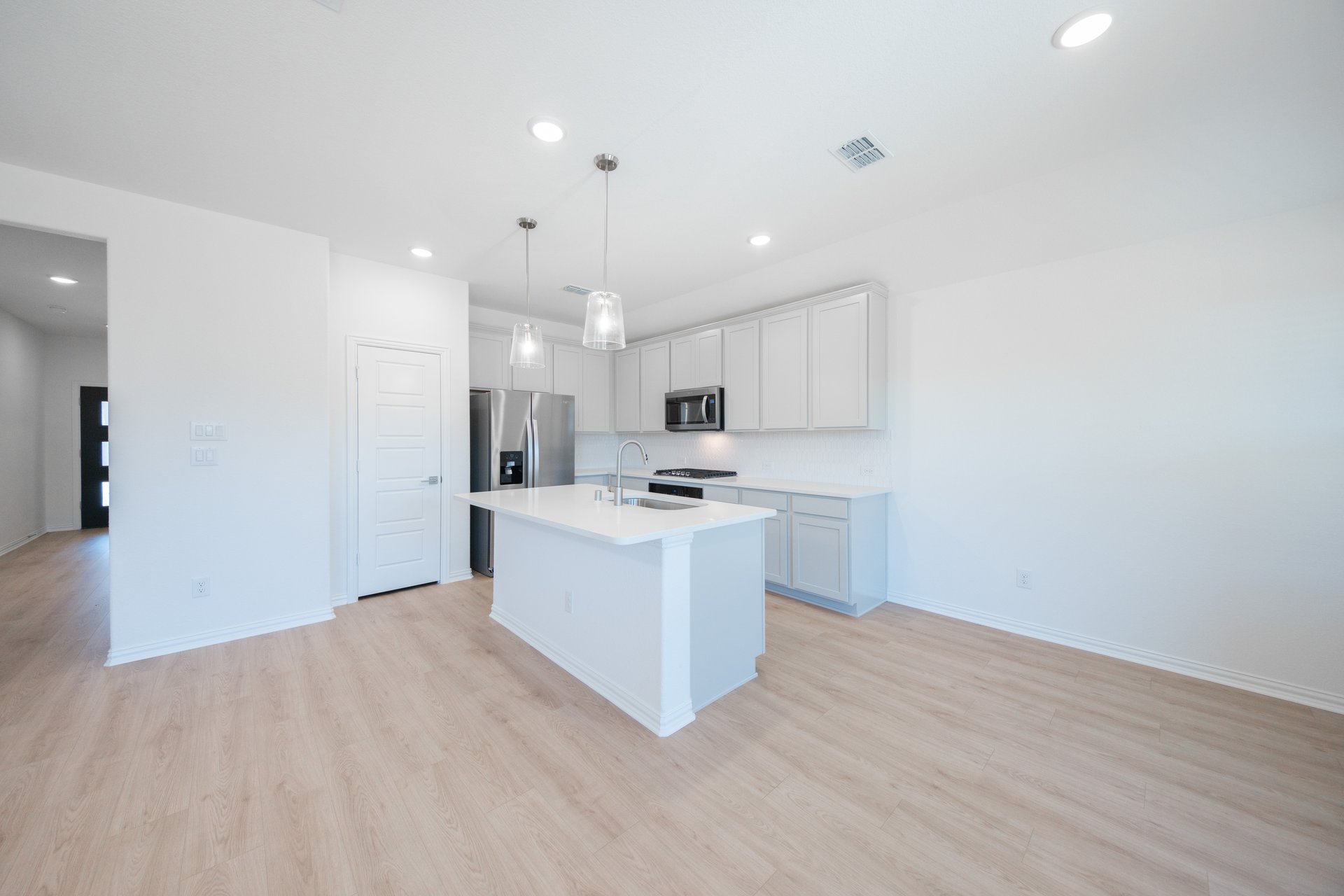 open kitchen with gray cabinets