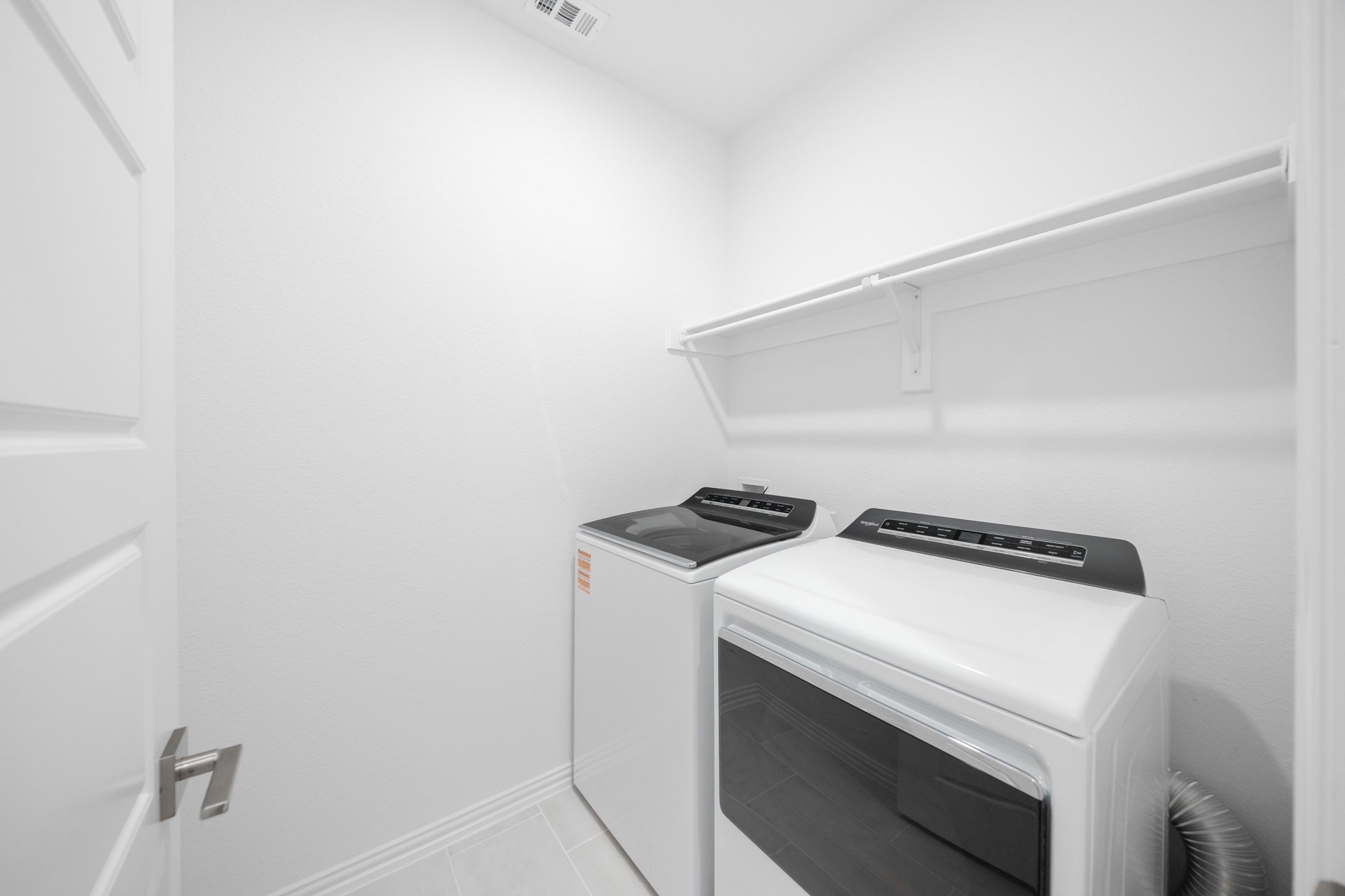 laundry room with included washer and dryer