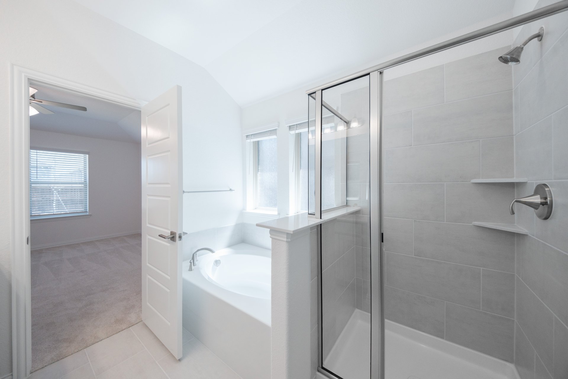 primary bathroom with soaking tub and shower