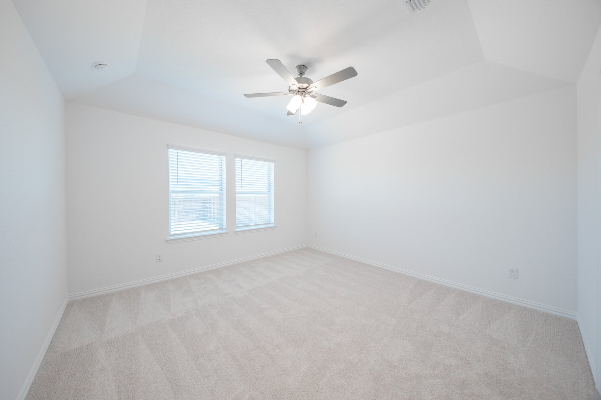primary bedroom with carpet