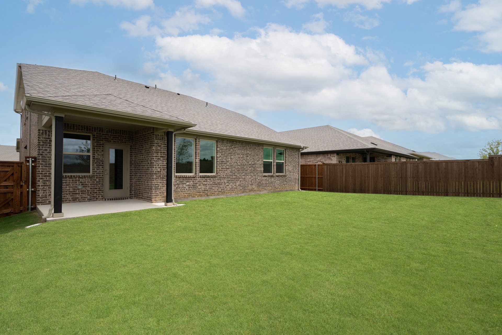 backyard with grass and covered patio