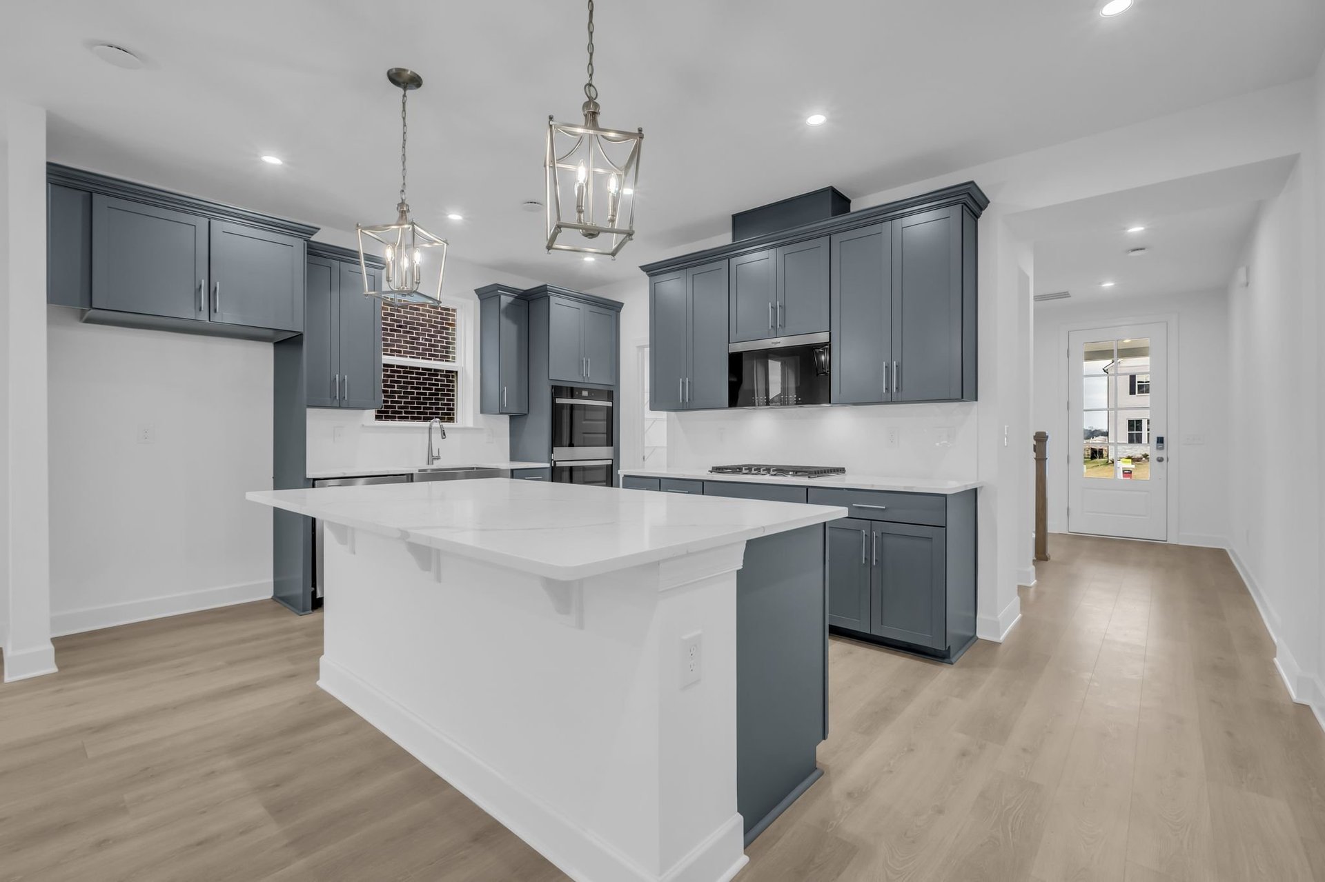 kitchen with gray cabinets and white countertops