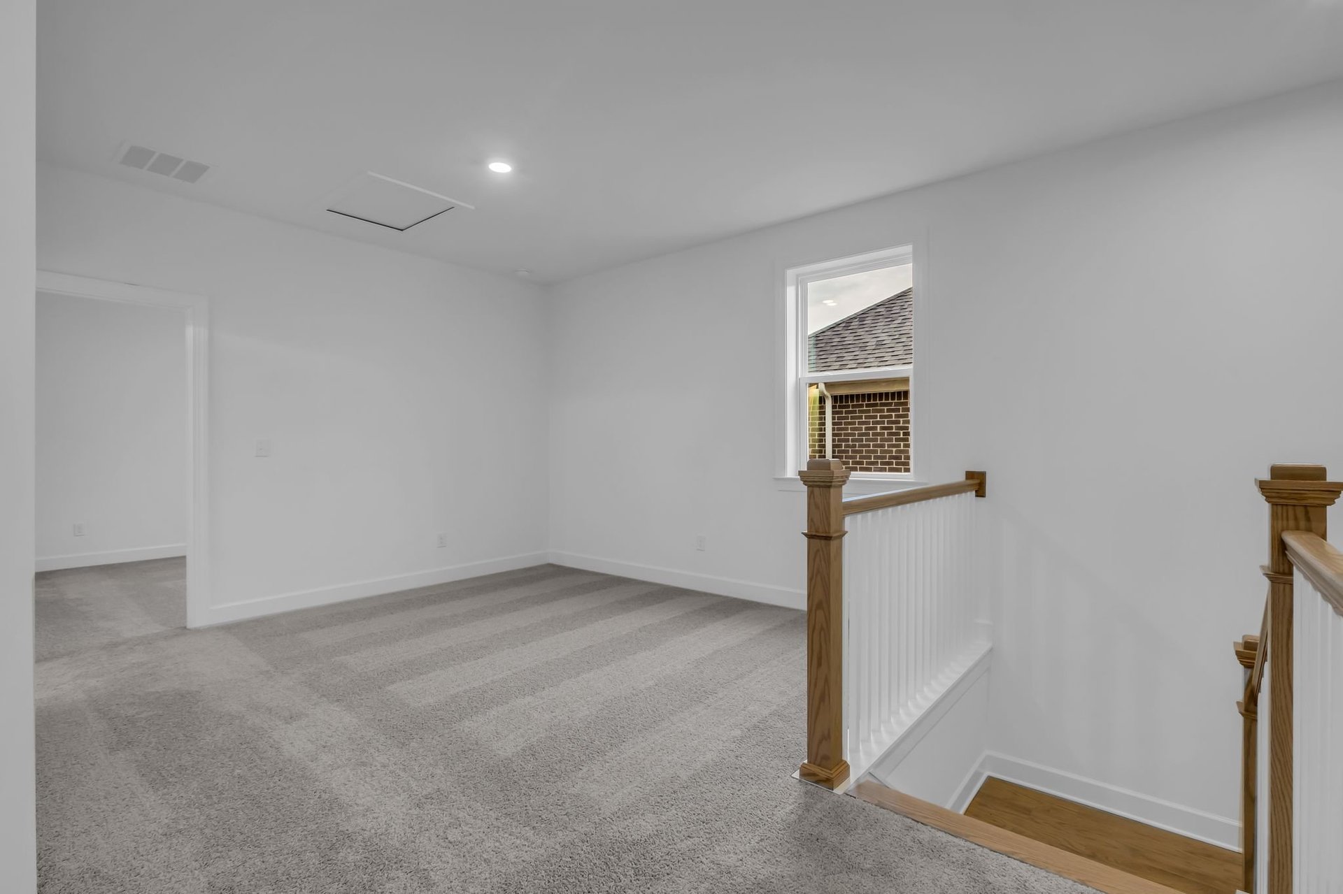 loft with carpet flooring