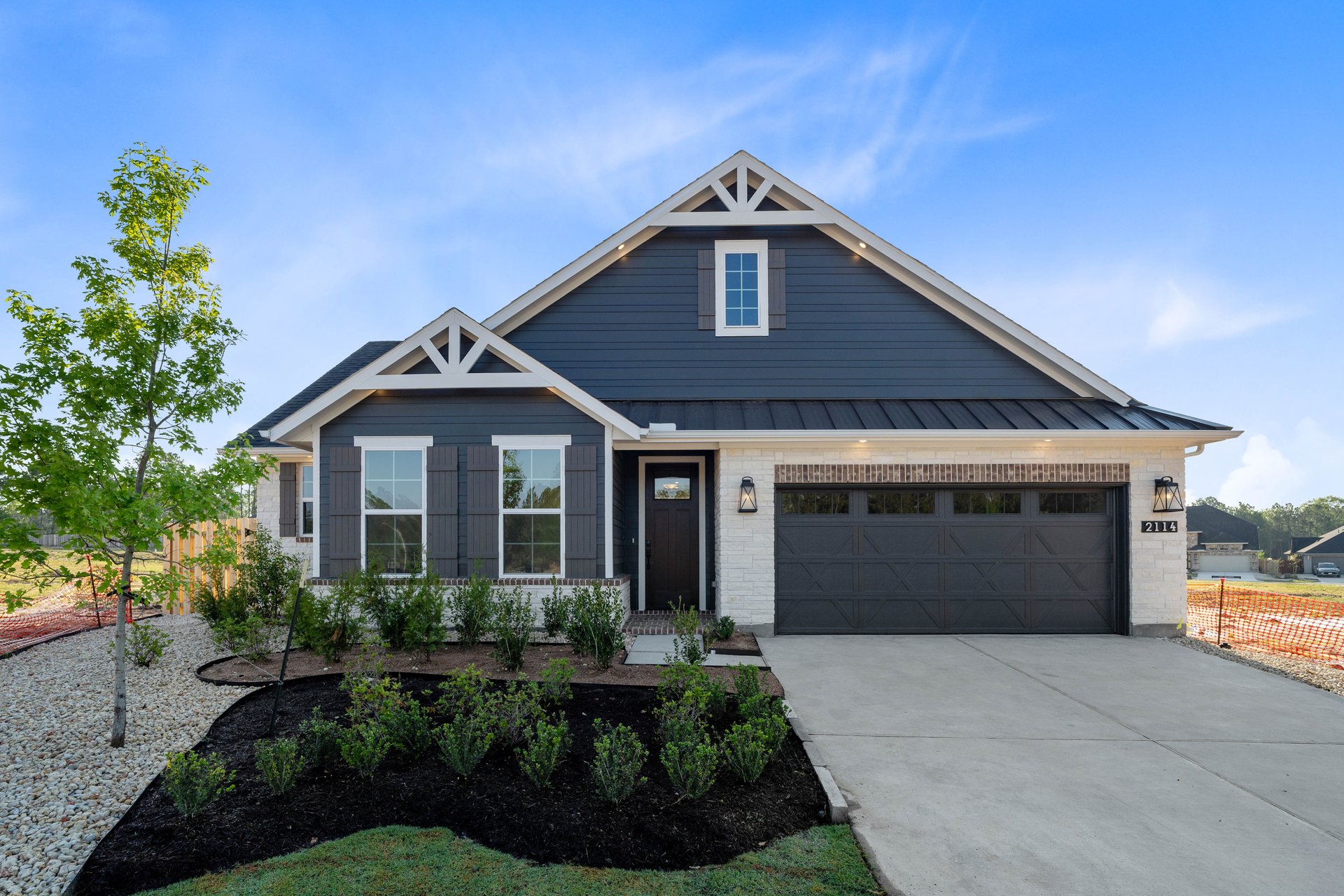 exterior of home with blue siding and white stone