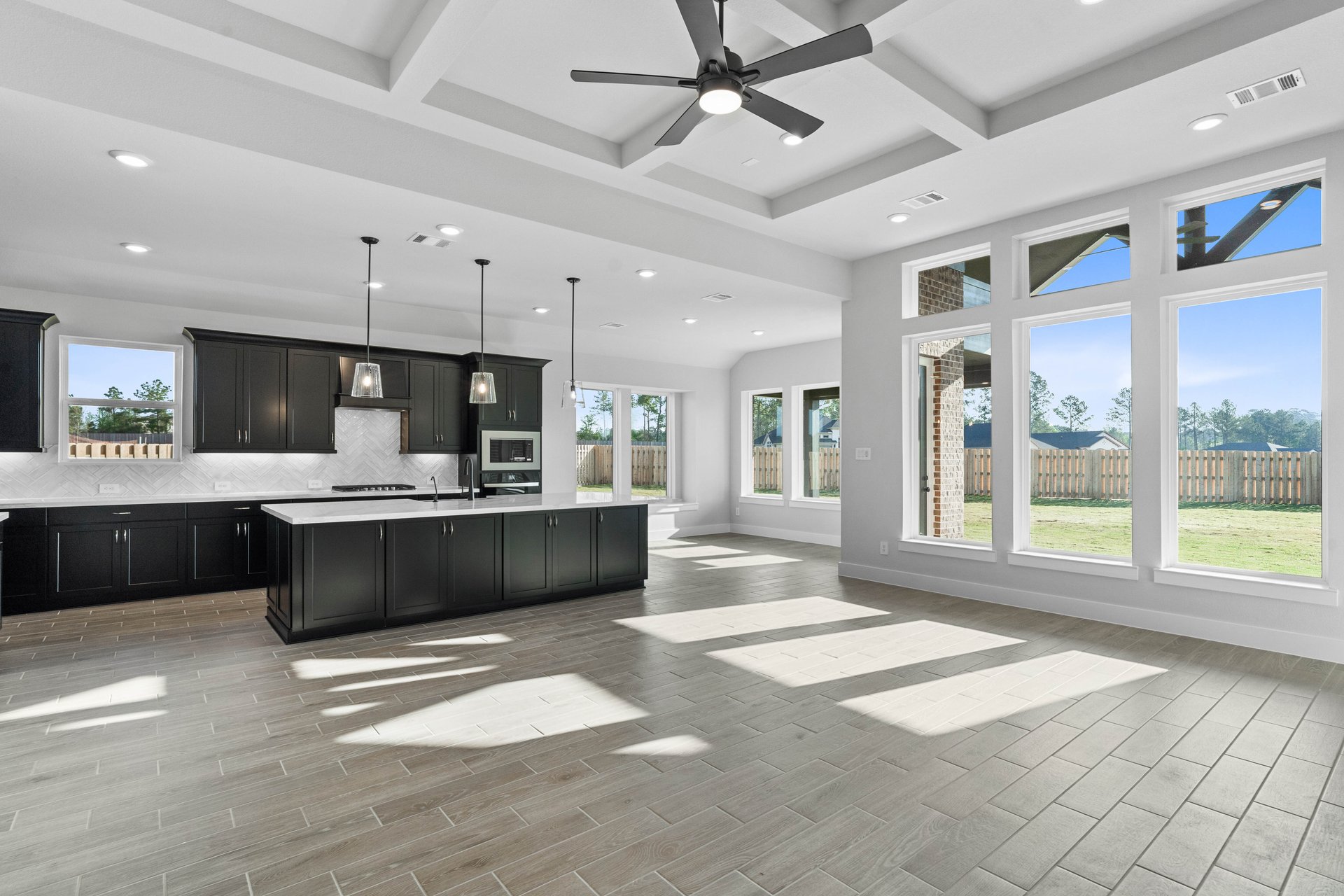 kitchen and dining area with wood-look tile flooring