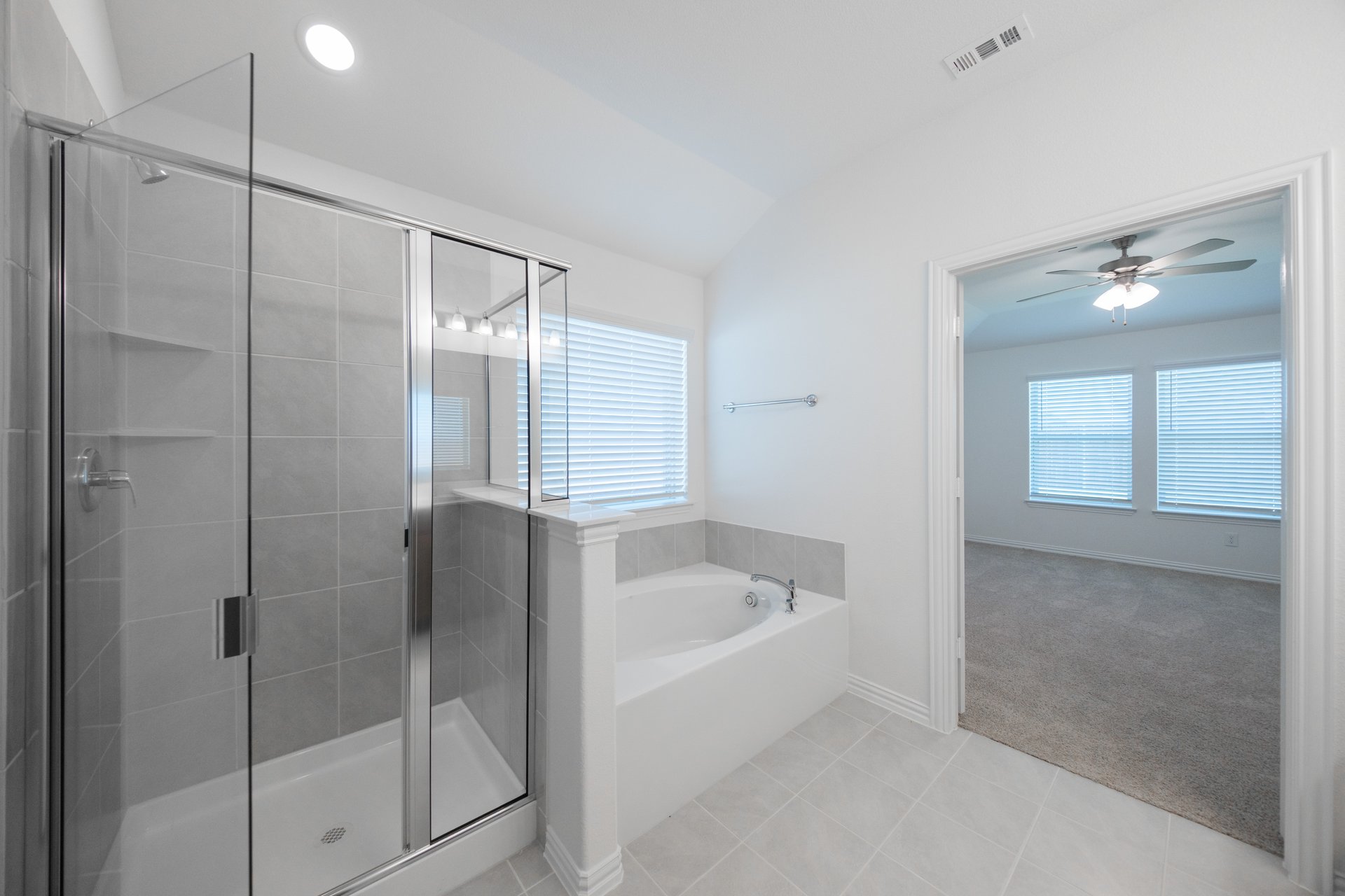 primary bathroom with soaking tub and walk-in shower