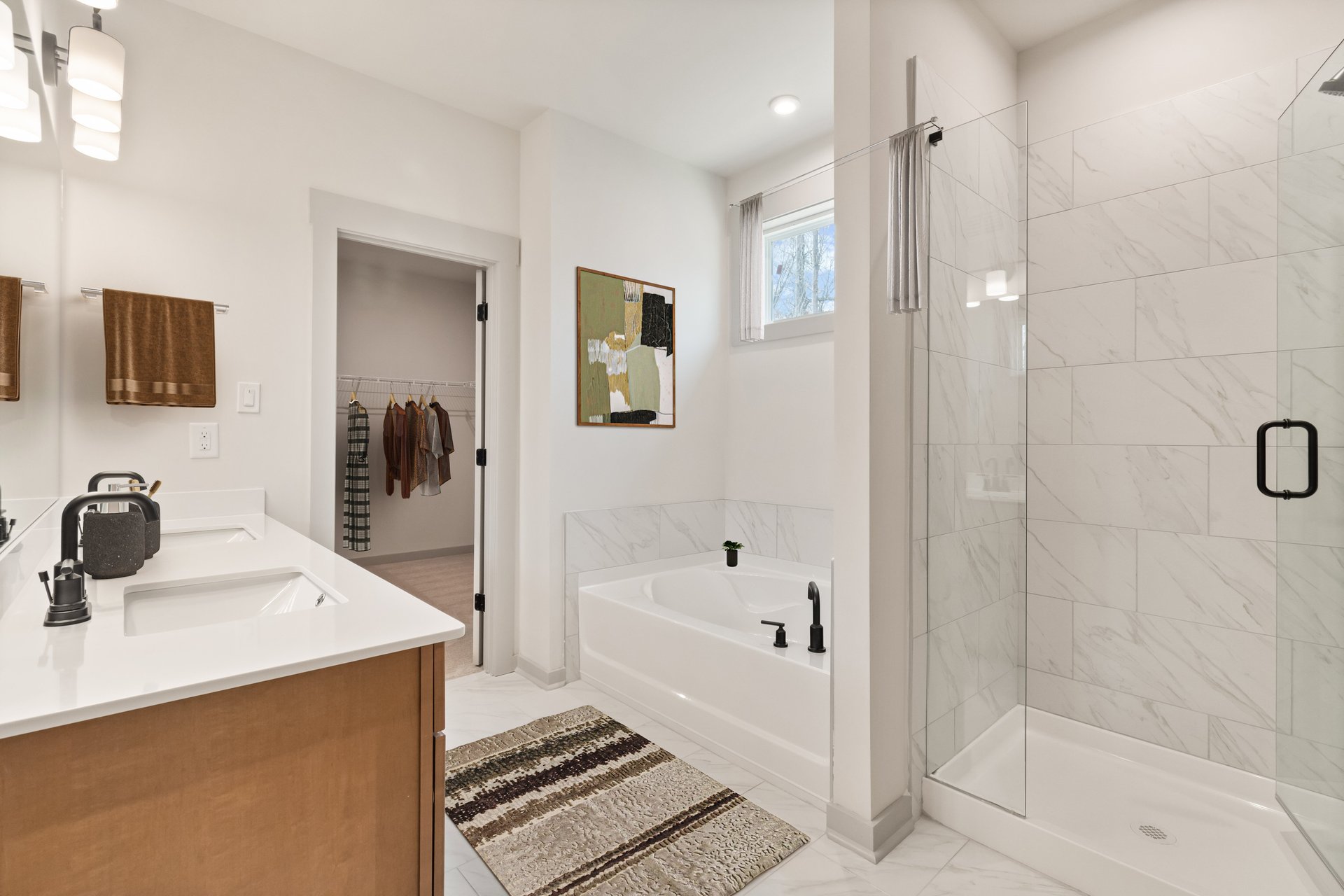 primary bathroom with separate shower and tub