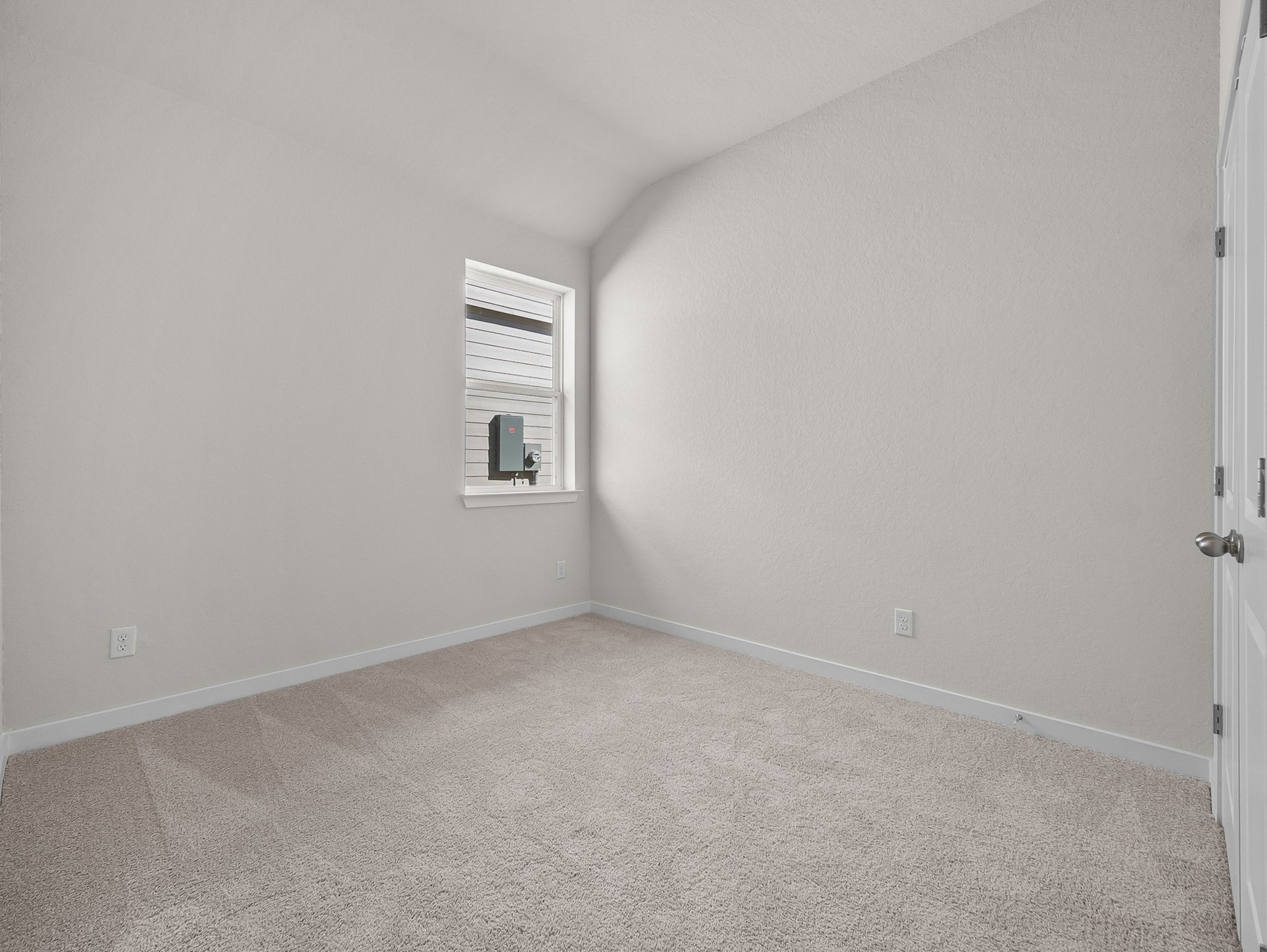 bedroom with carpet, window & a sloped ceiling