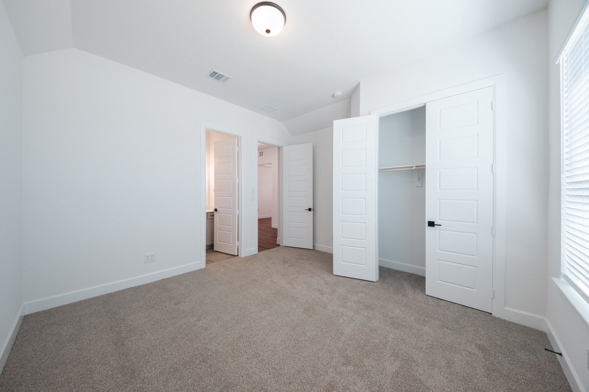 guest bedroom with carpet
