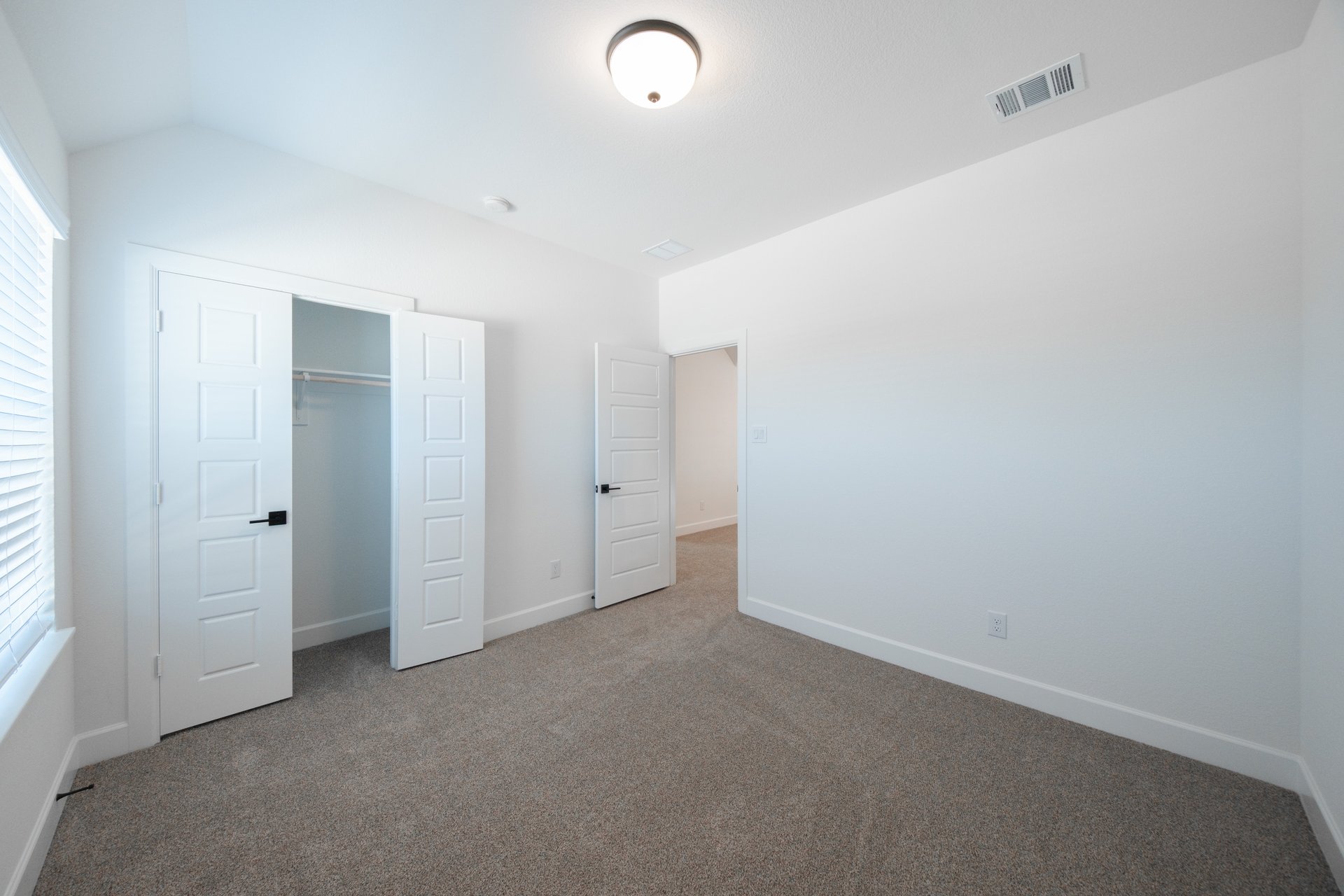 guest bedroom with carpet