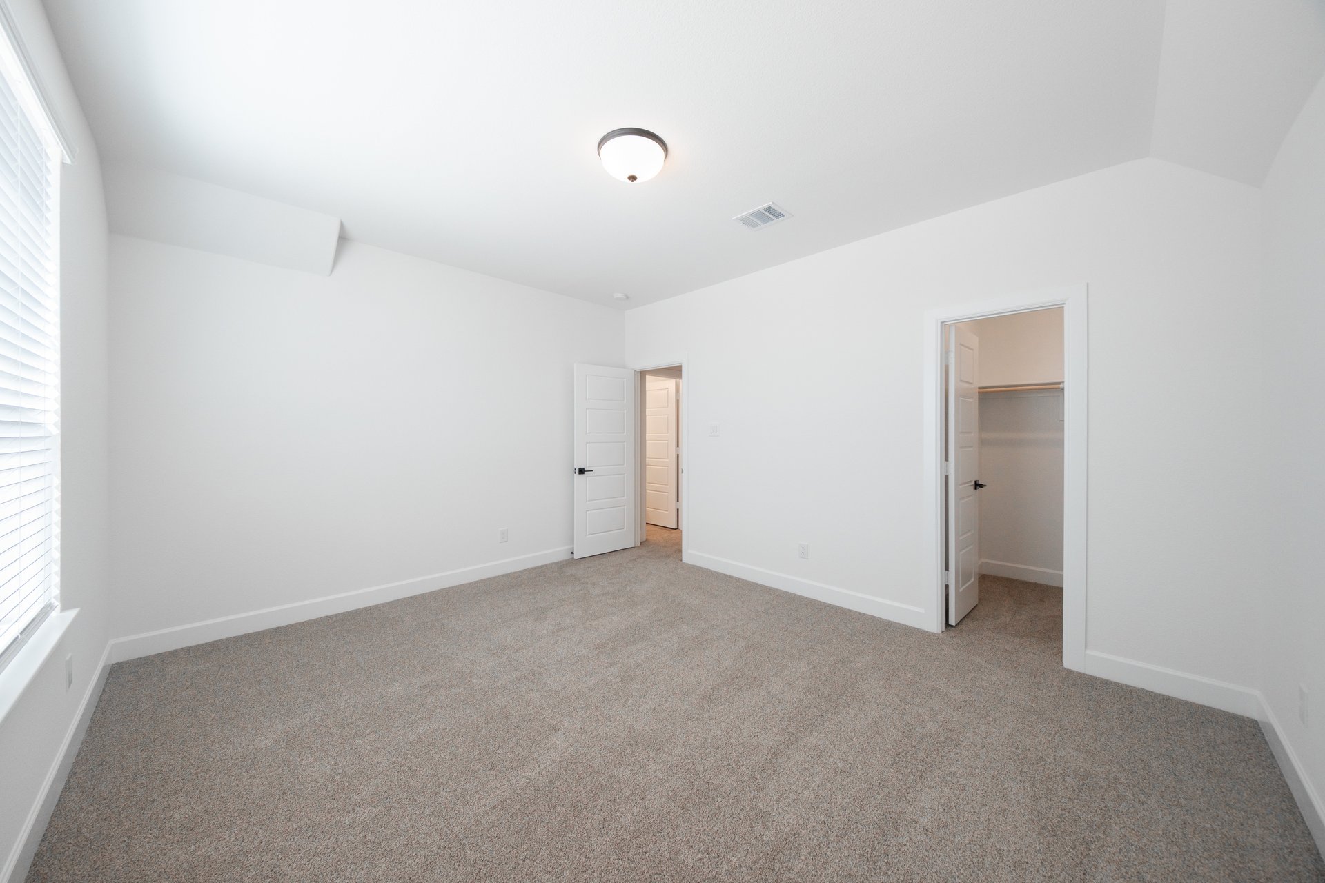 guest bedroom with carpet