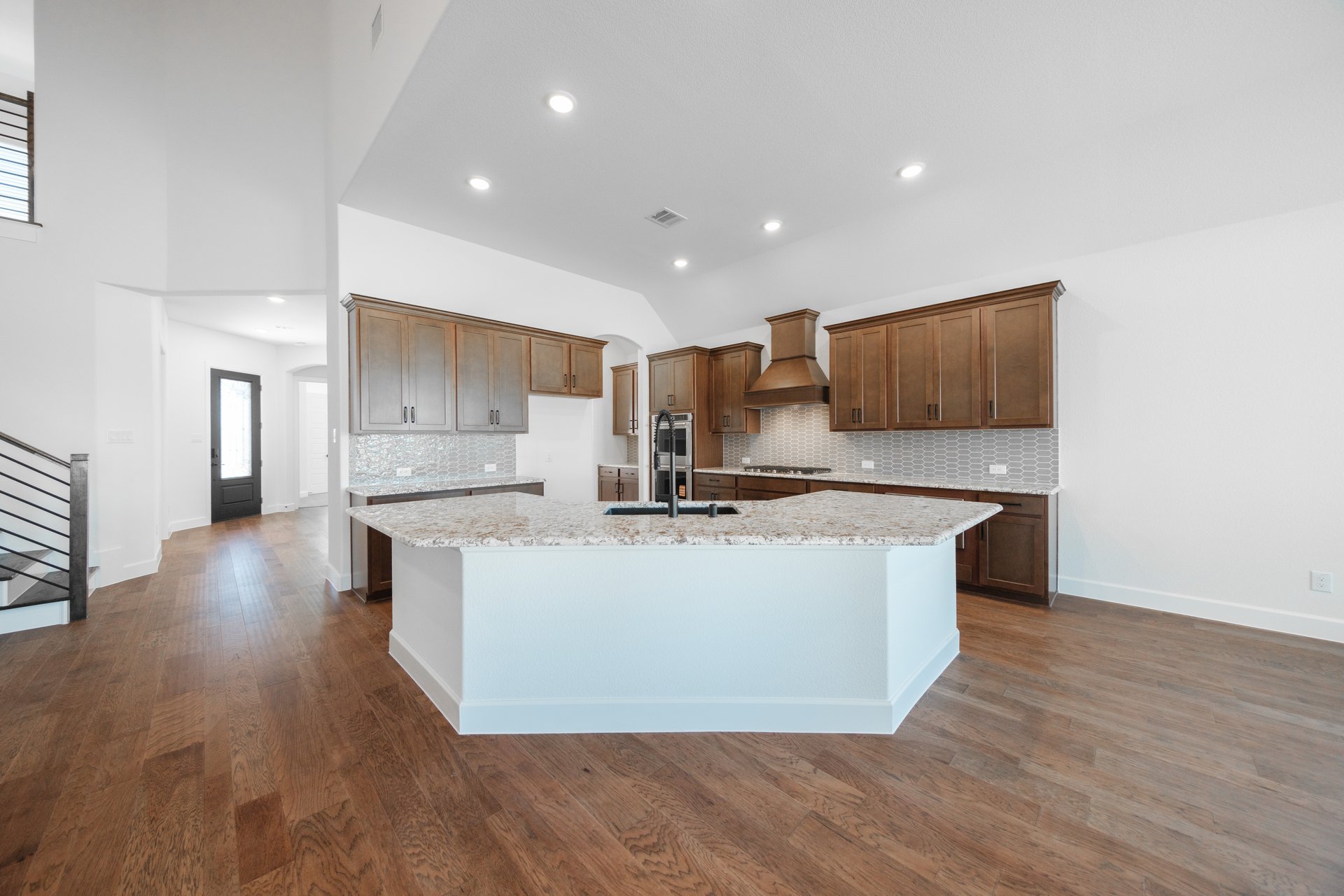 open kitchen with brown cabinets