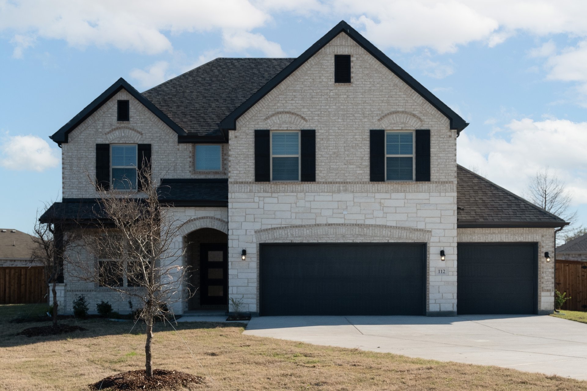 two-story home with brick and stone exterior