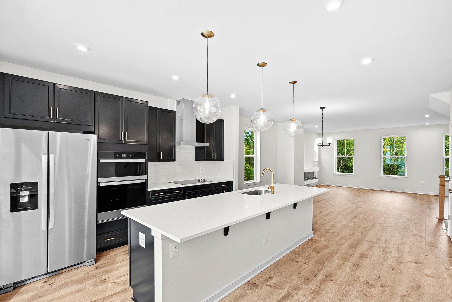 kitchen with stainless steel appliances and pendant lighting