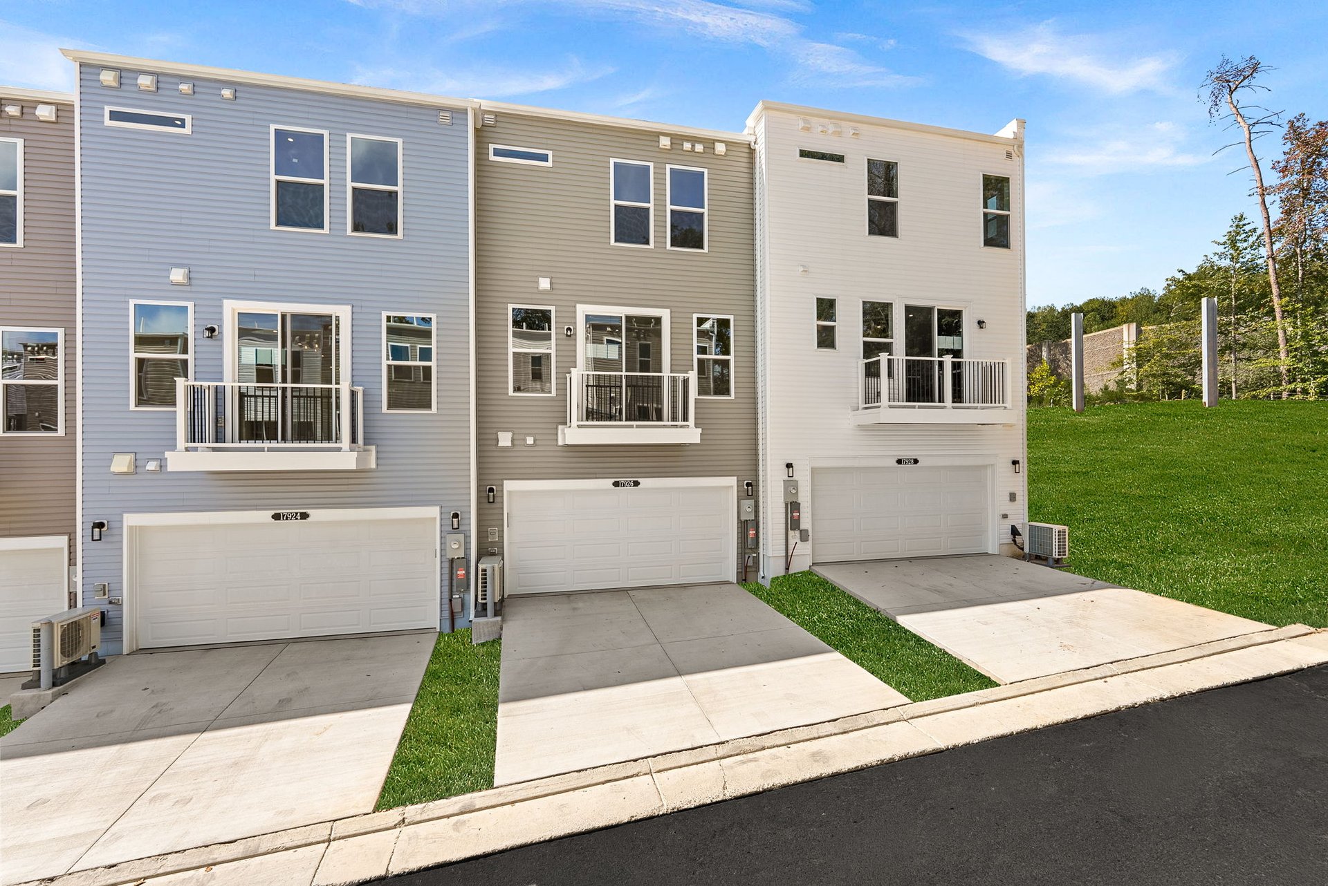 rear exterior of home with a 2-car garage