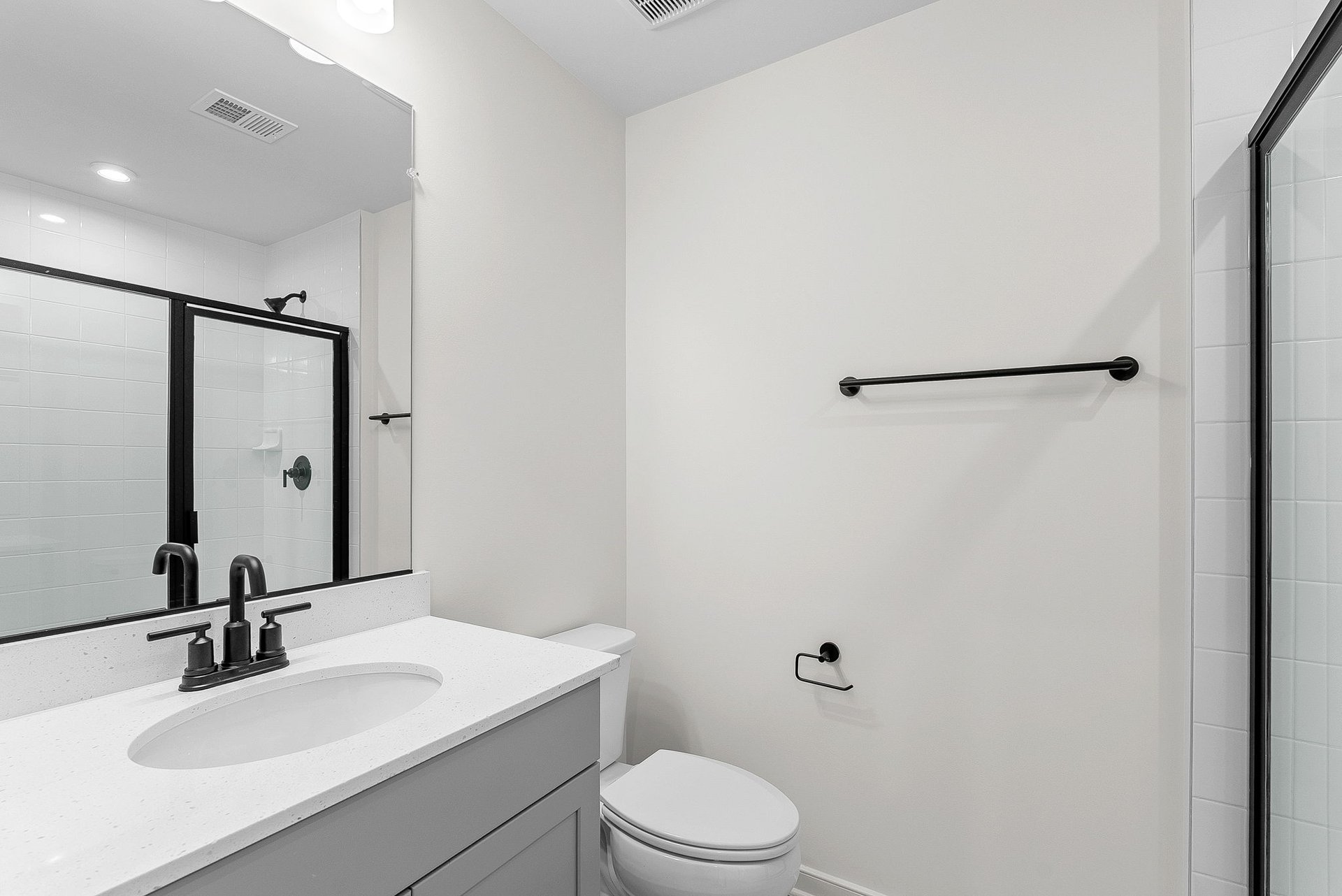 first-floor full bathroom with an oversized shower