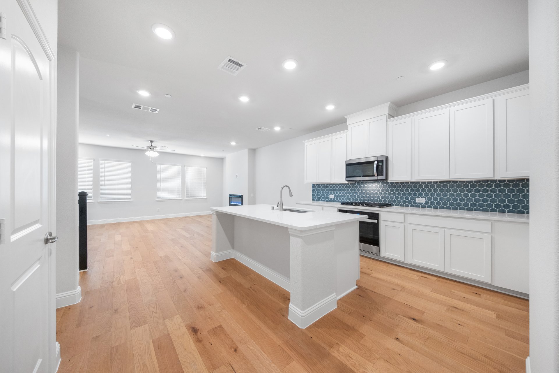 kitchen with large island and white countertops