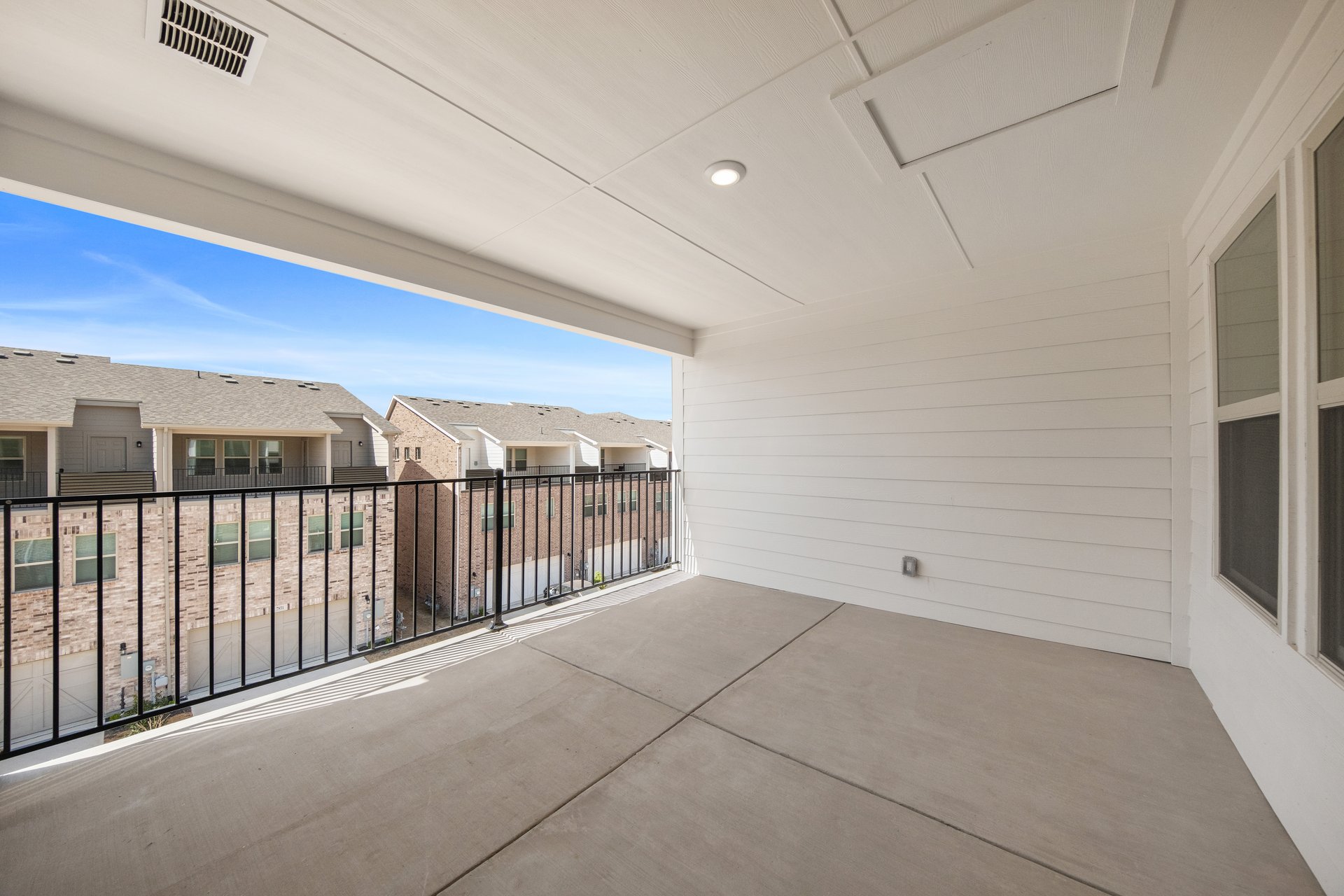 terrace with windows and iron railing