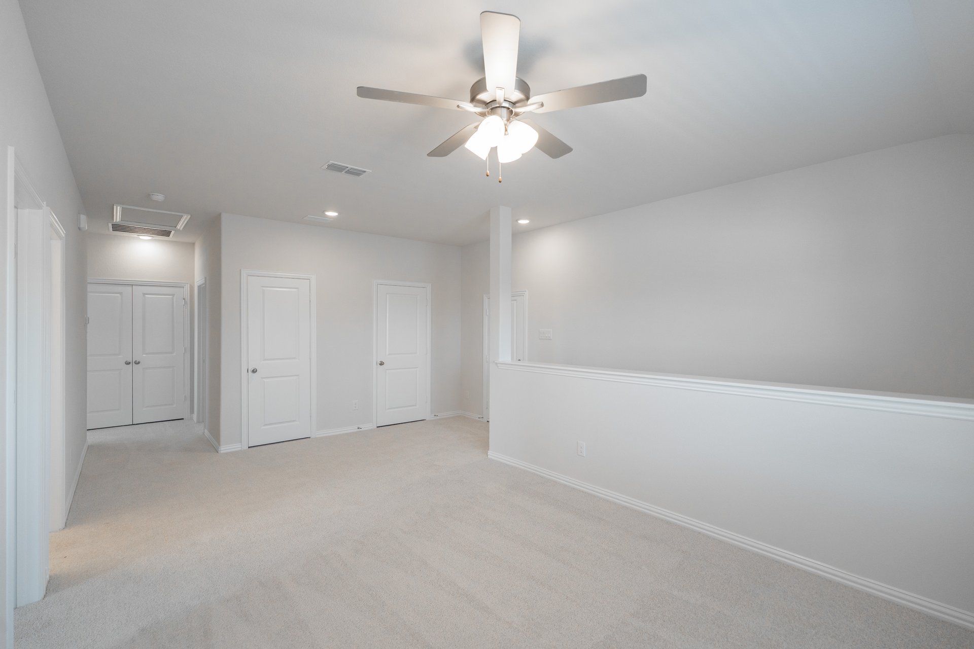 open gameroom with carpet and ceiling fan