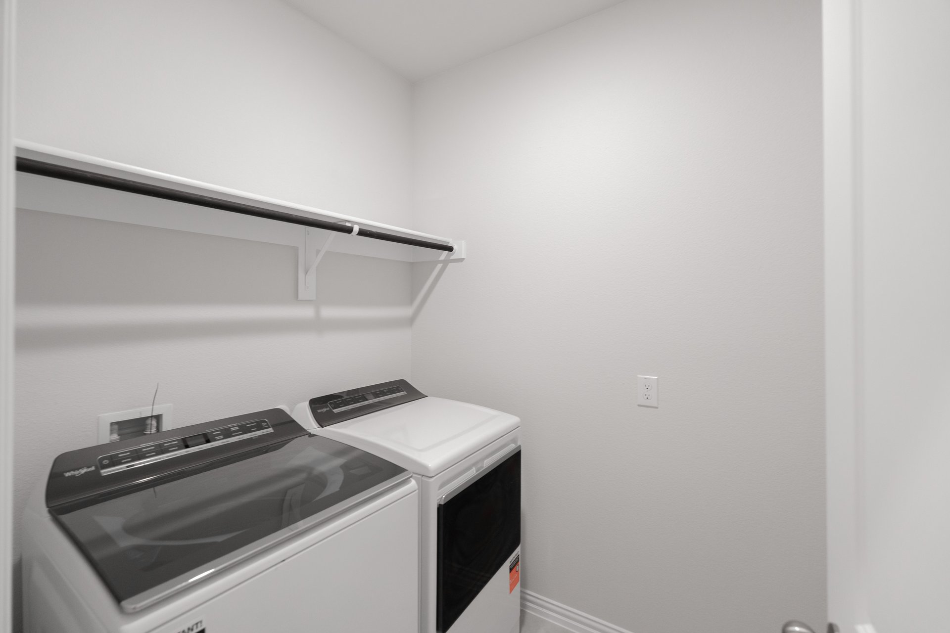 laundry room with tile floors, washer, and dryer