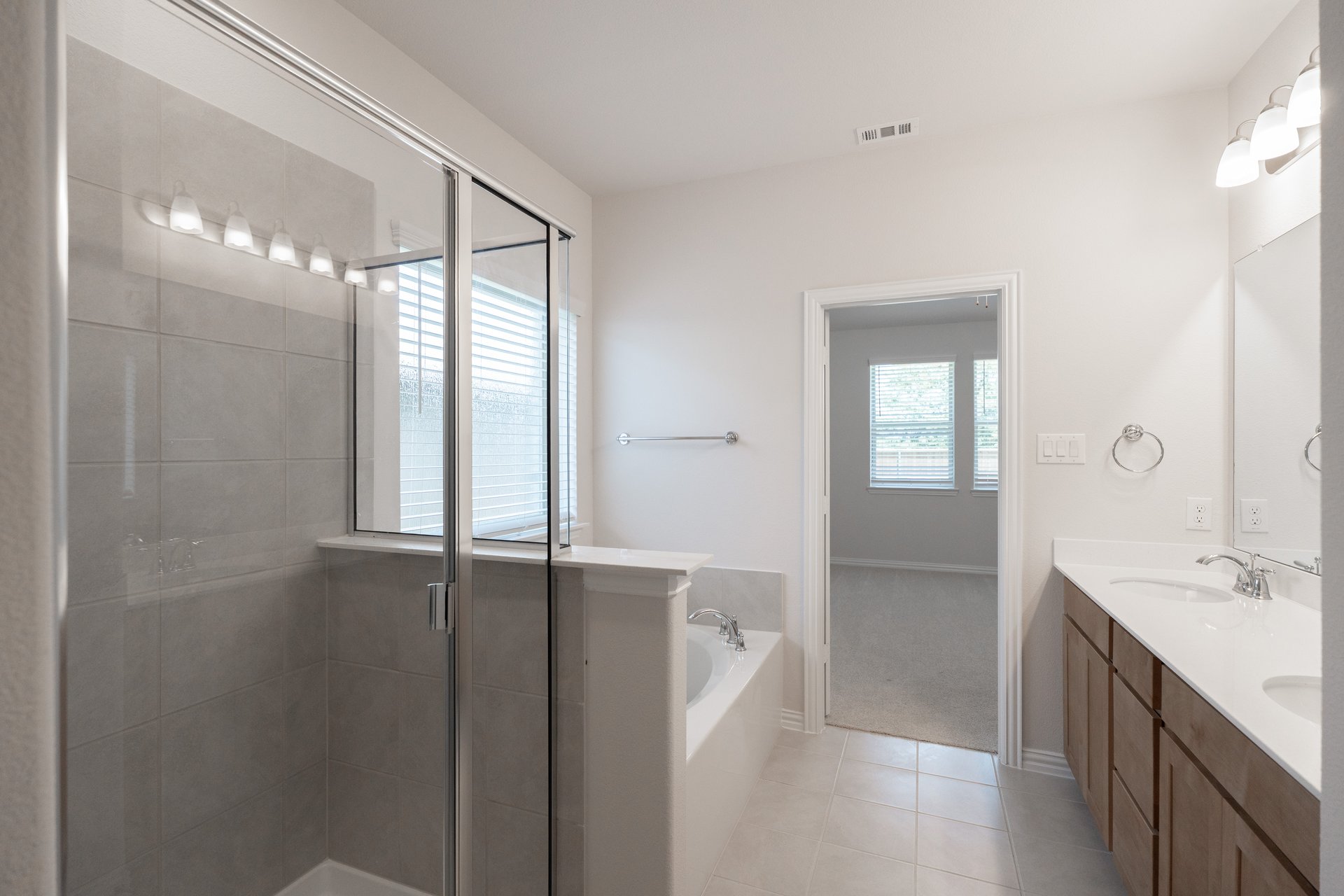 primary bathroom with soaking tub and walk-in shower