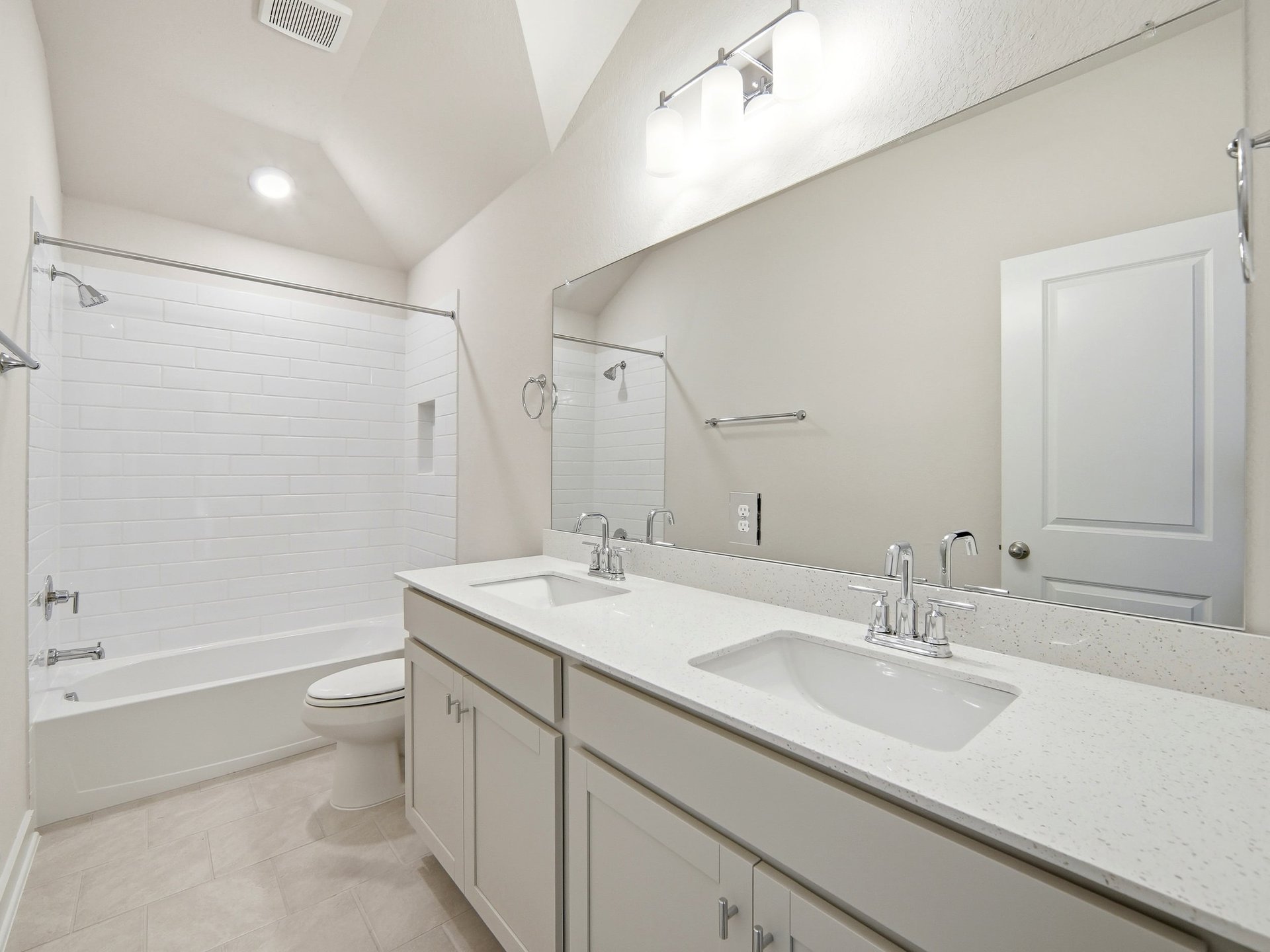 secondary bath with dual sinks and a soaking tub