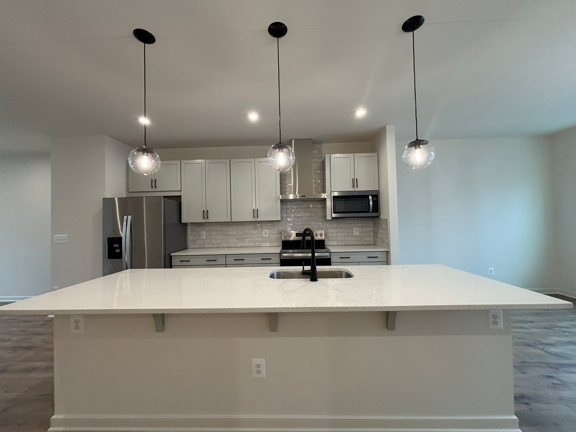 kitchen with an island with a sink