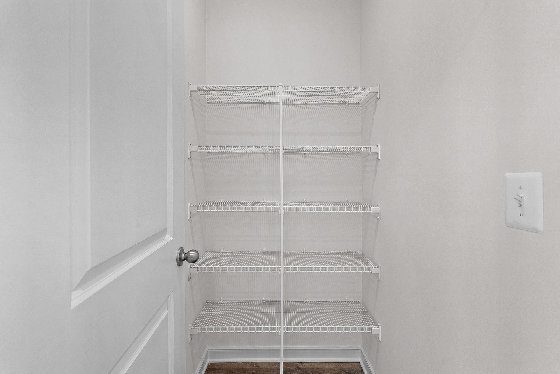 walk-in pantry with wire shelving