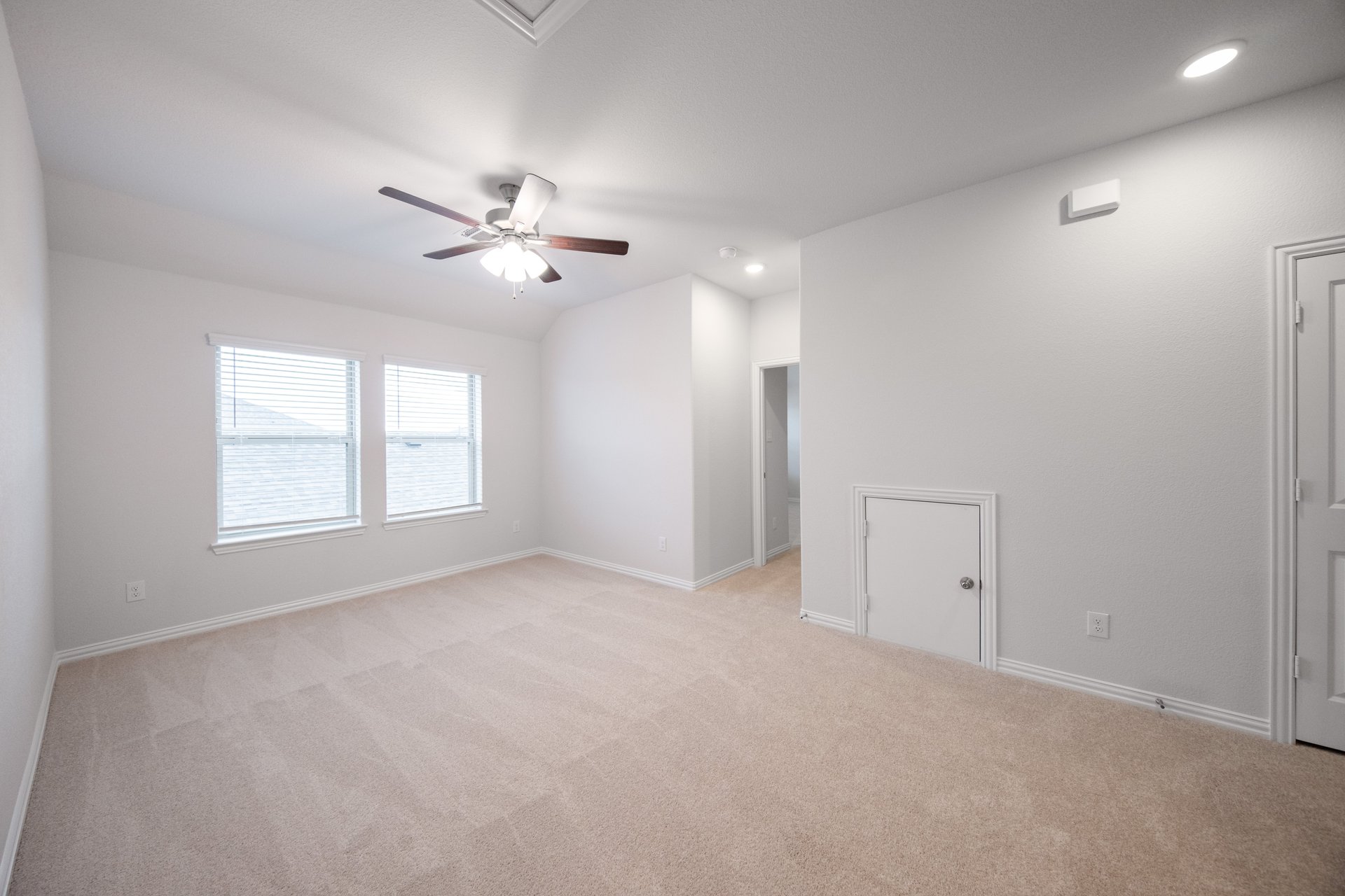 game room with carpet and windows with blinds
