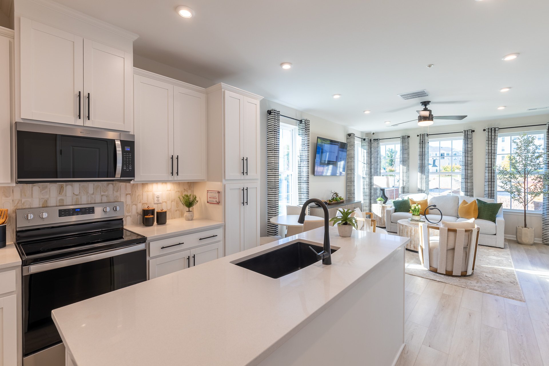 white kitchen overlooks the open great room