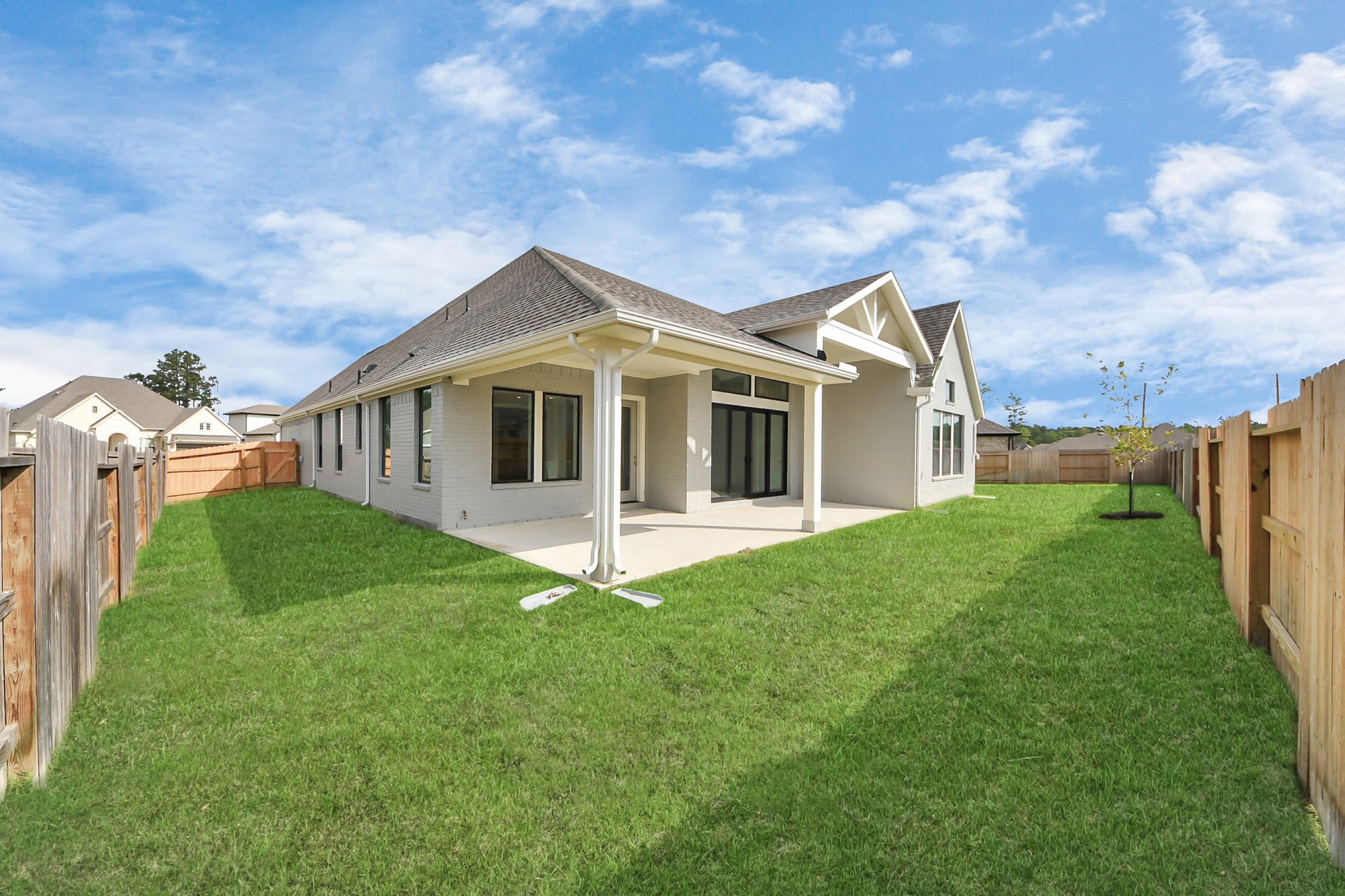 large covered back patio and fully sodded yard