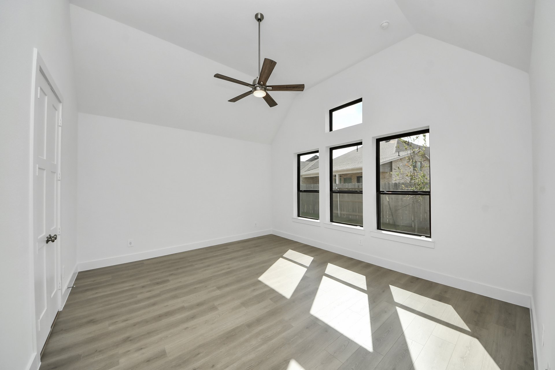 tall ceilings and wood flooring