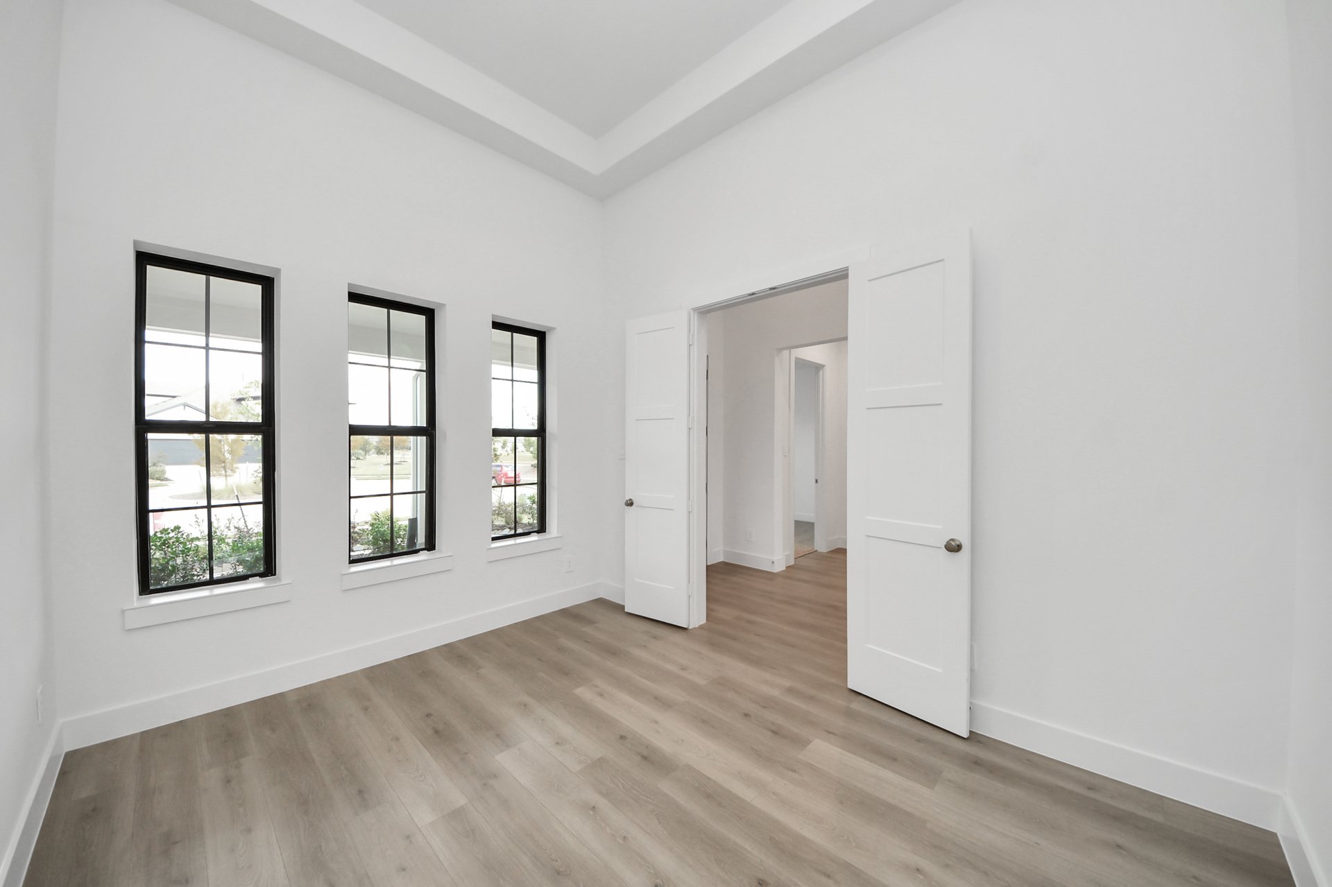 tall ceilings and wood flooring