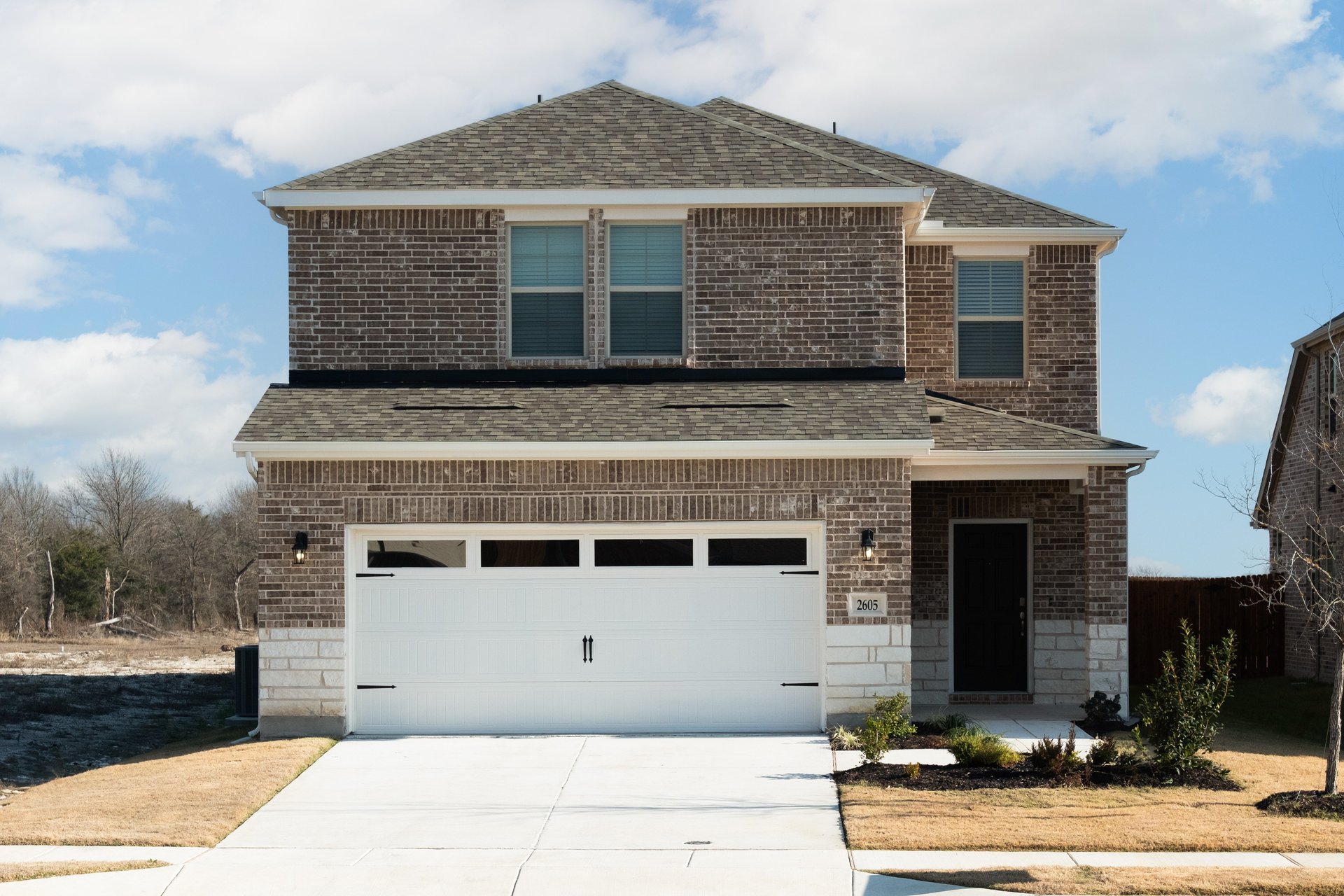 home exterior with brick and stone