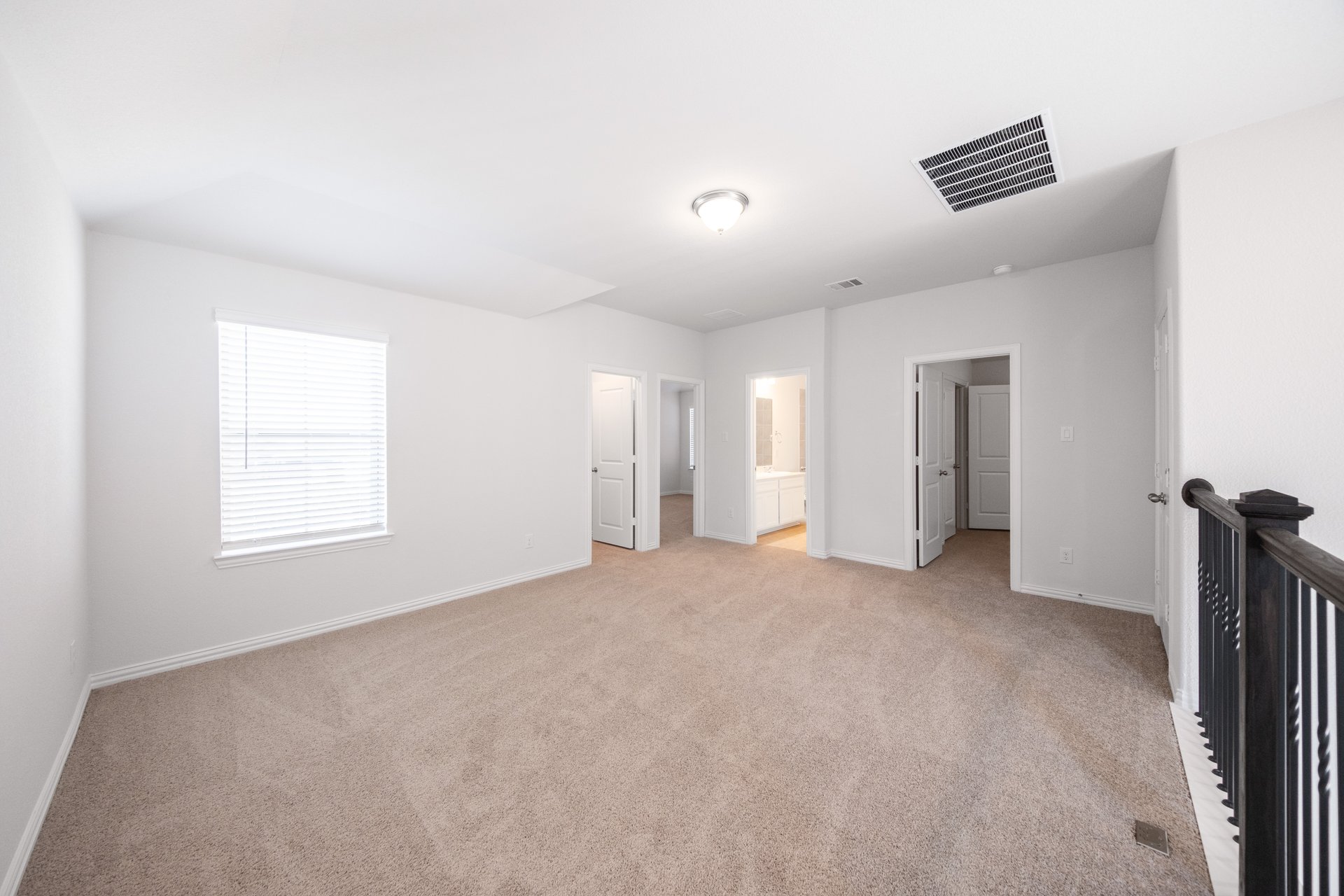 loft with carpet and window with blinds