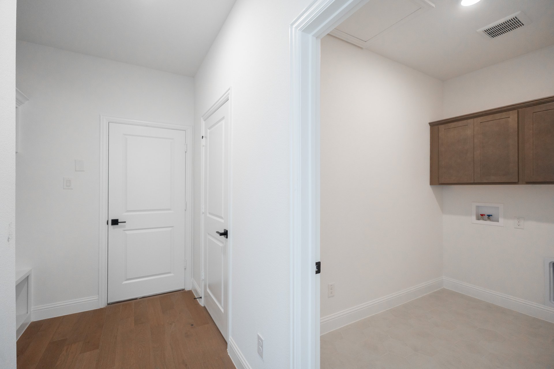 laundry room with tile floors 
