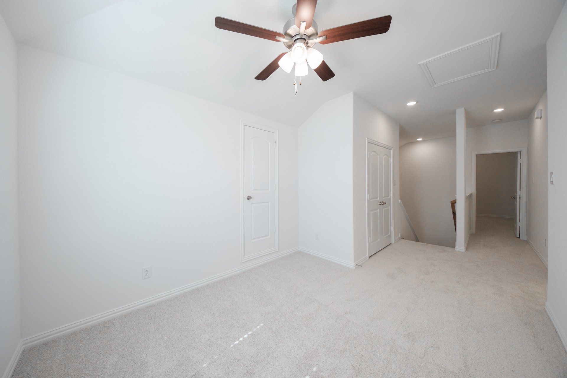 open gameroom with carpet and ceiling fan