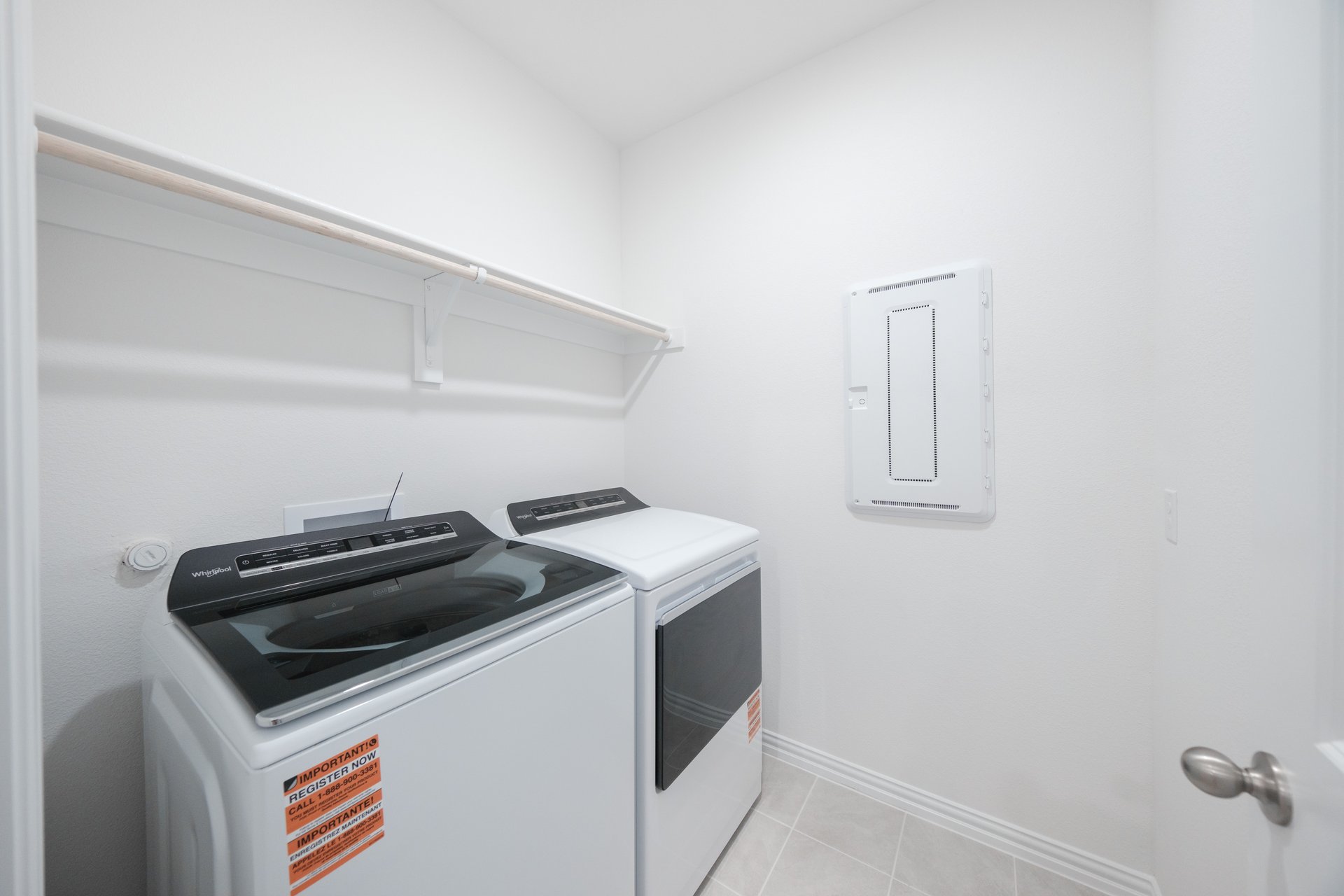 laundry room with tile floors, washer, and dryer