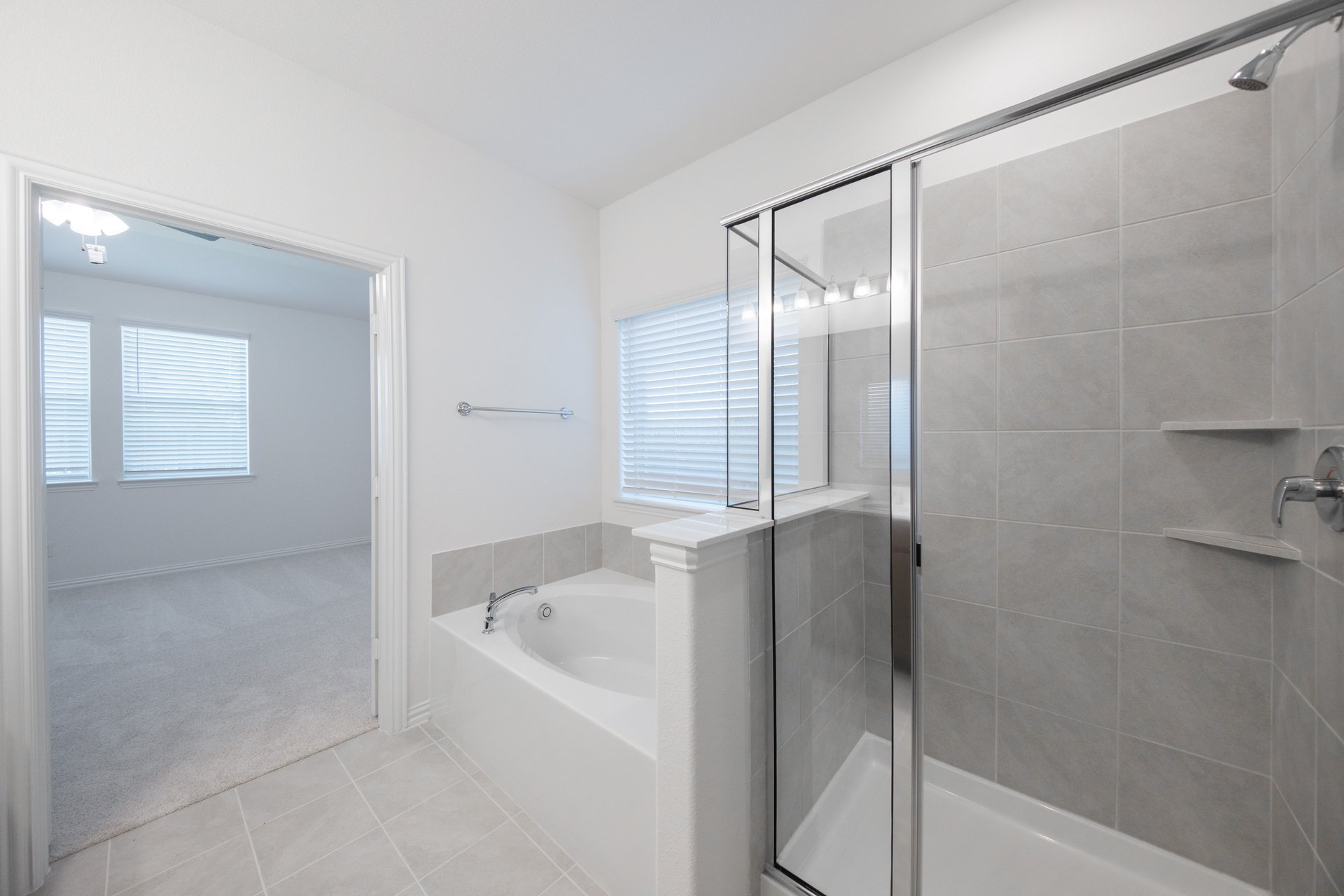 primary bathroom with soaking tub and walk-in shower