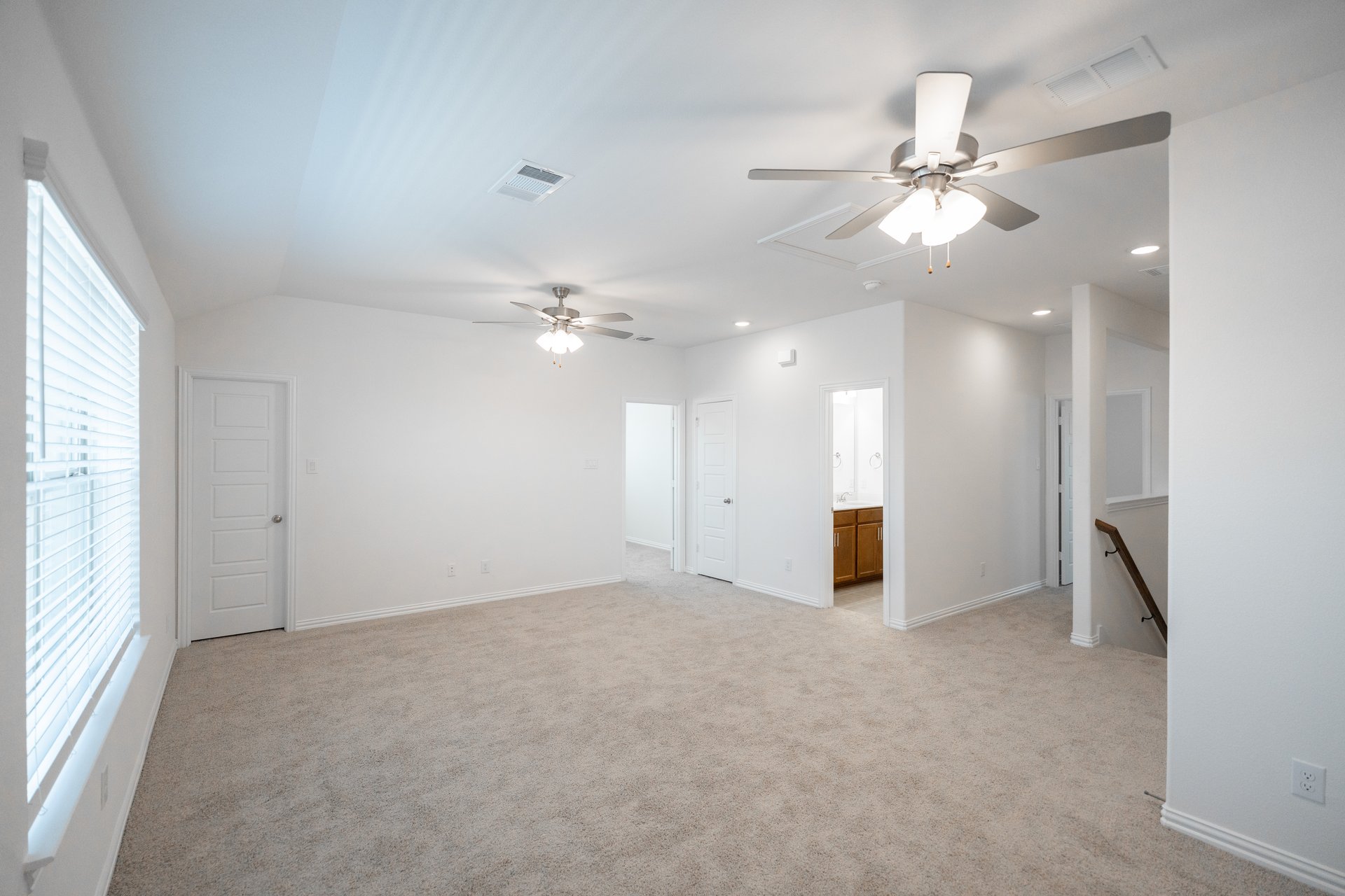 open gameroom with carpet and ceiling fan
