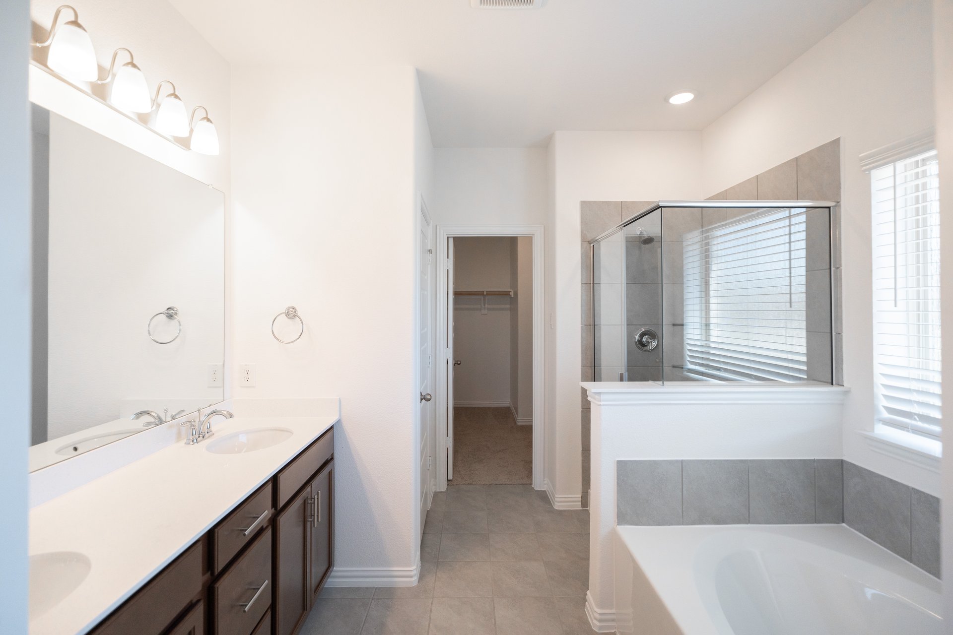 primary bathroom with soaking tub and walk-in shower
