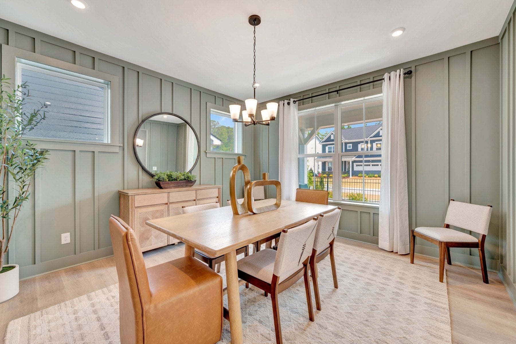 dining room with four windows and a rug