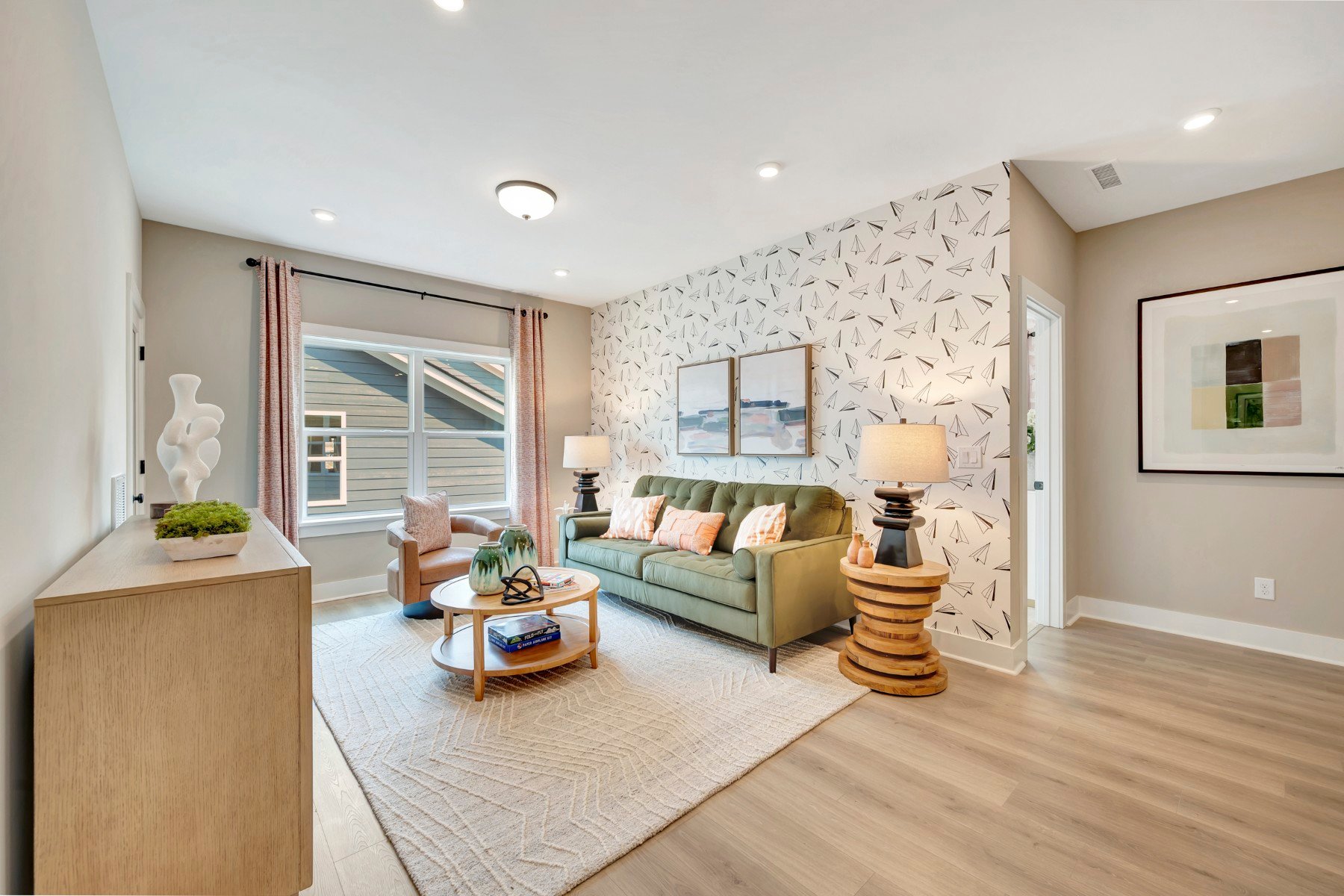 loft with two windows and a rug