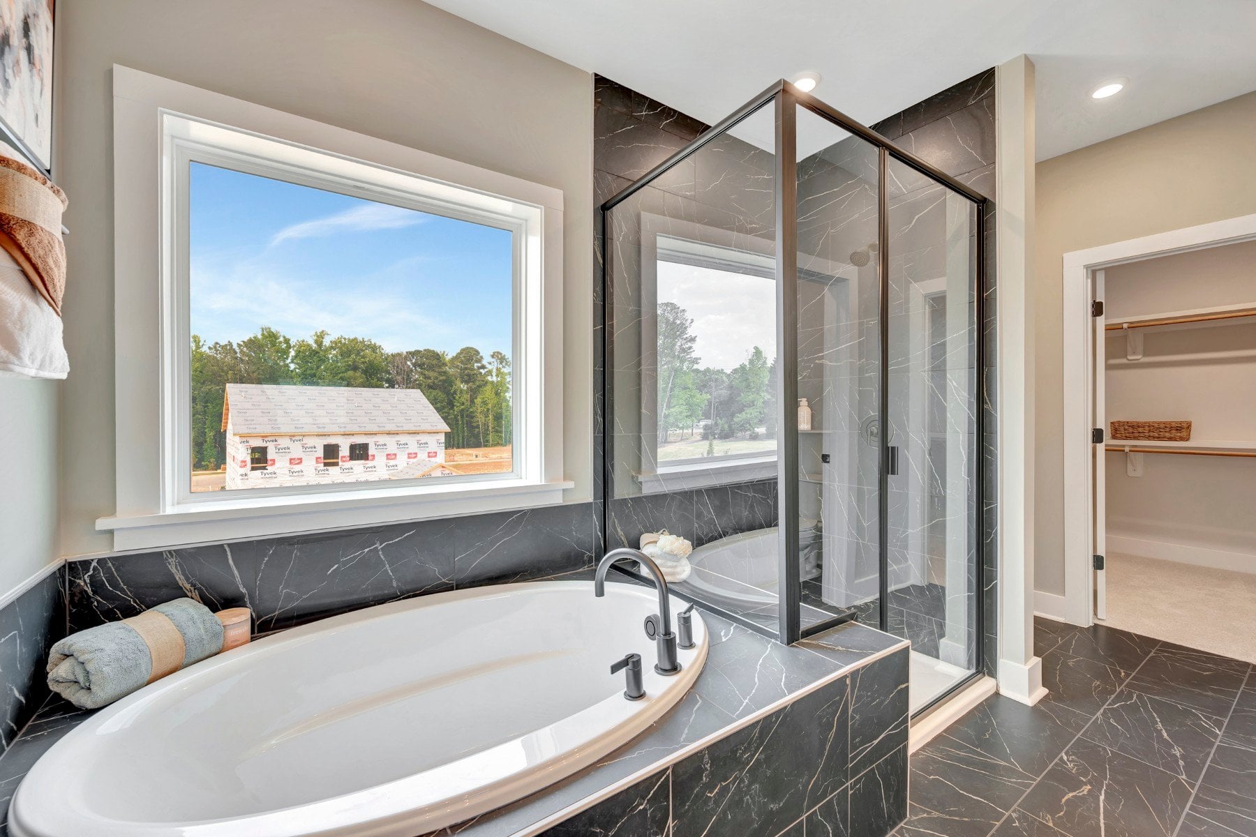 primary bath with separate tub and shower