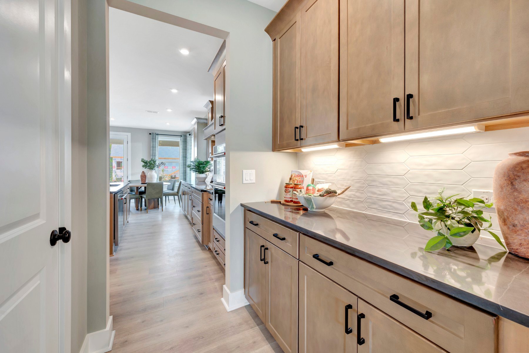 butler's pantry connecting the kitchen and the dining room
