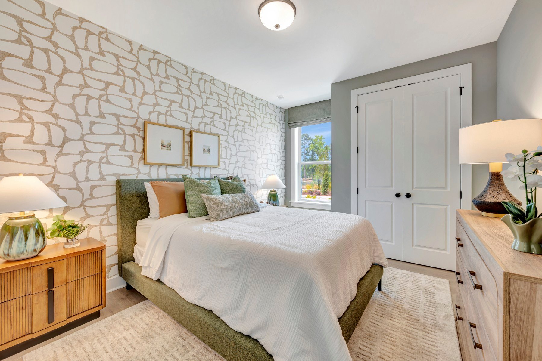 first floor bedroom with a window and a closet