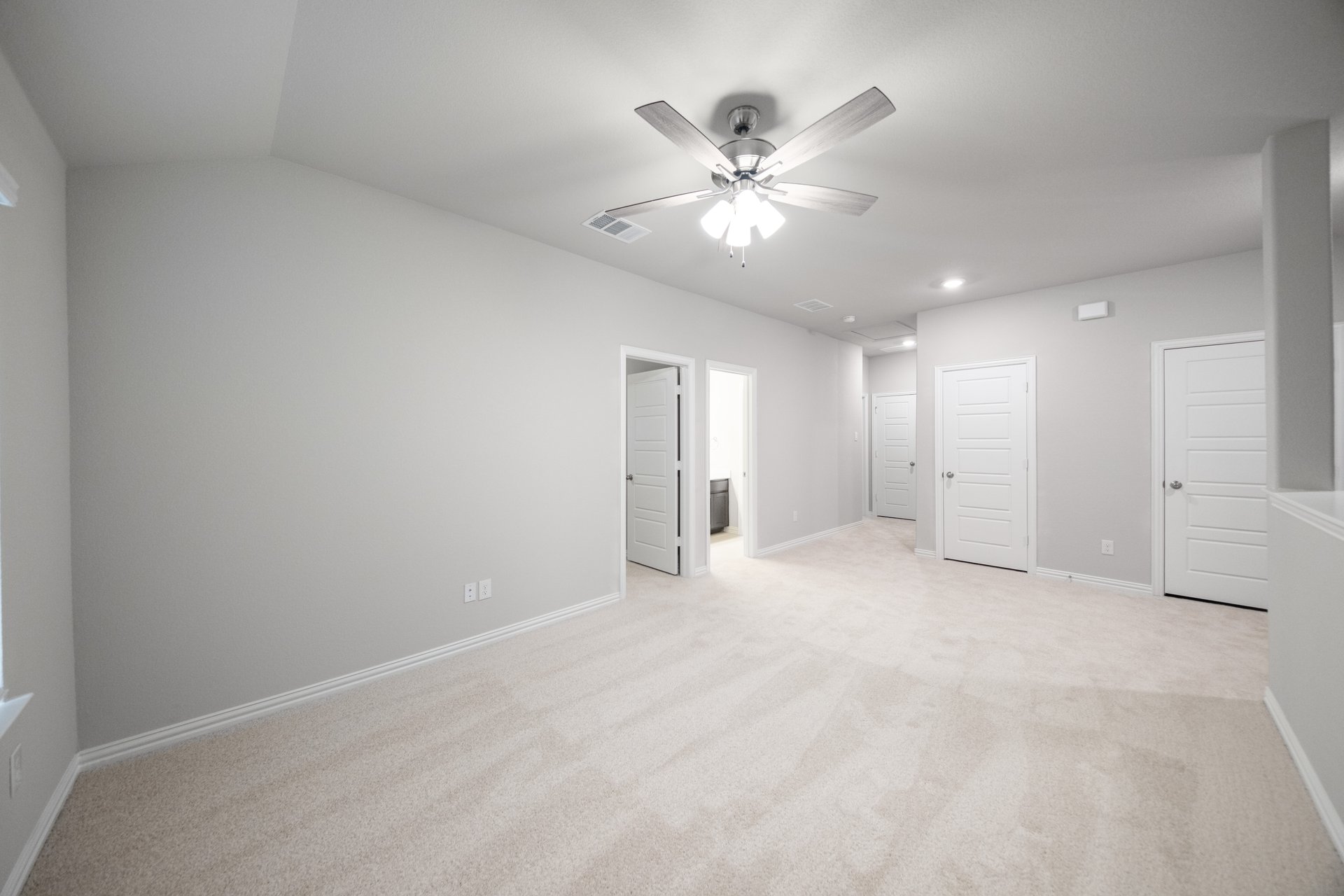 loft with carpet and windows