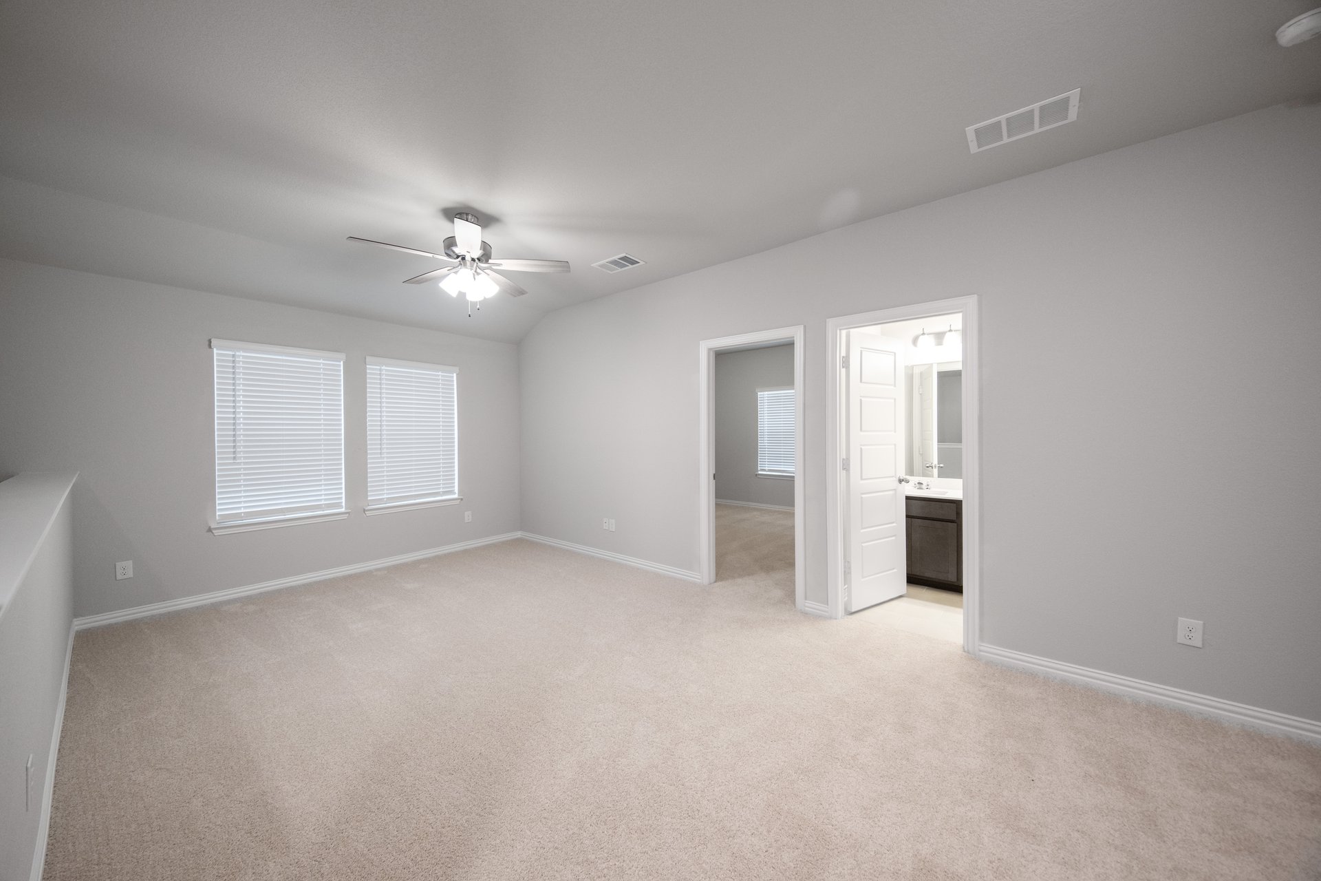 loft with carpet and windows