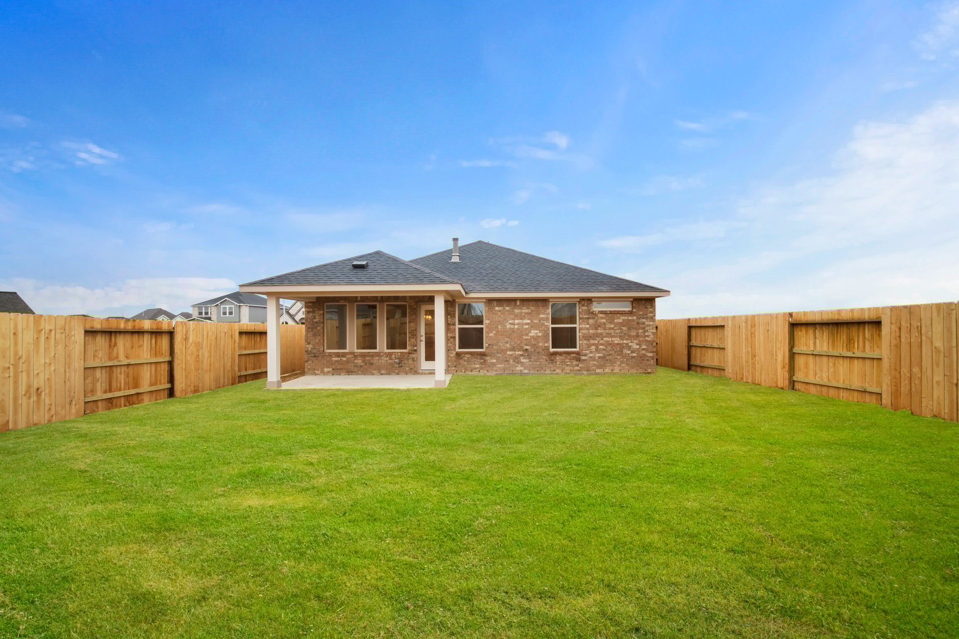 covered patio with wood fencing