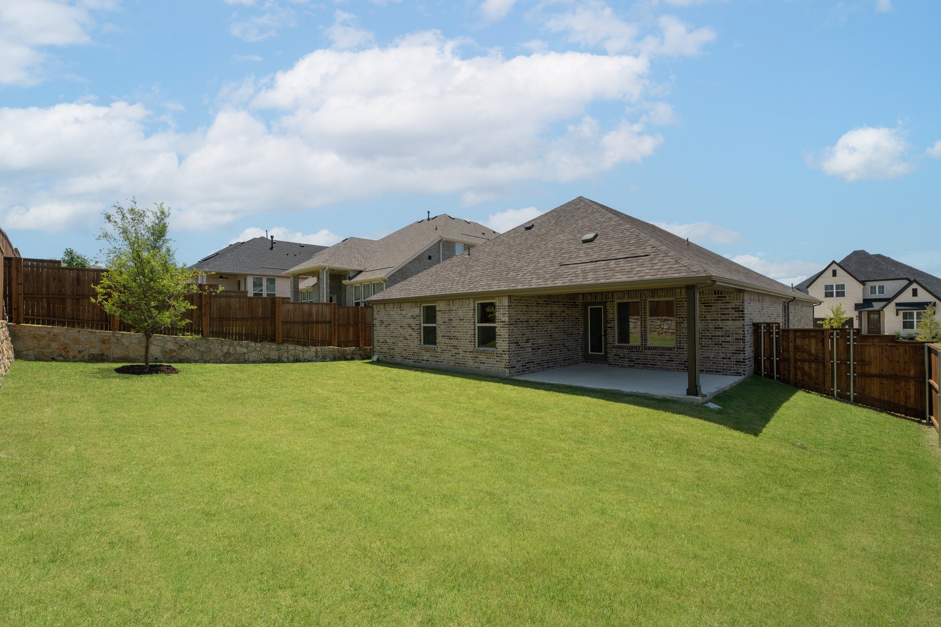 backyard with grass and covered patio
